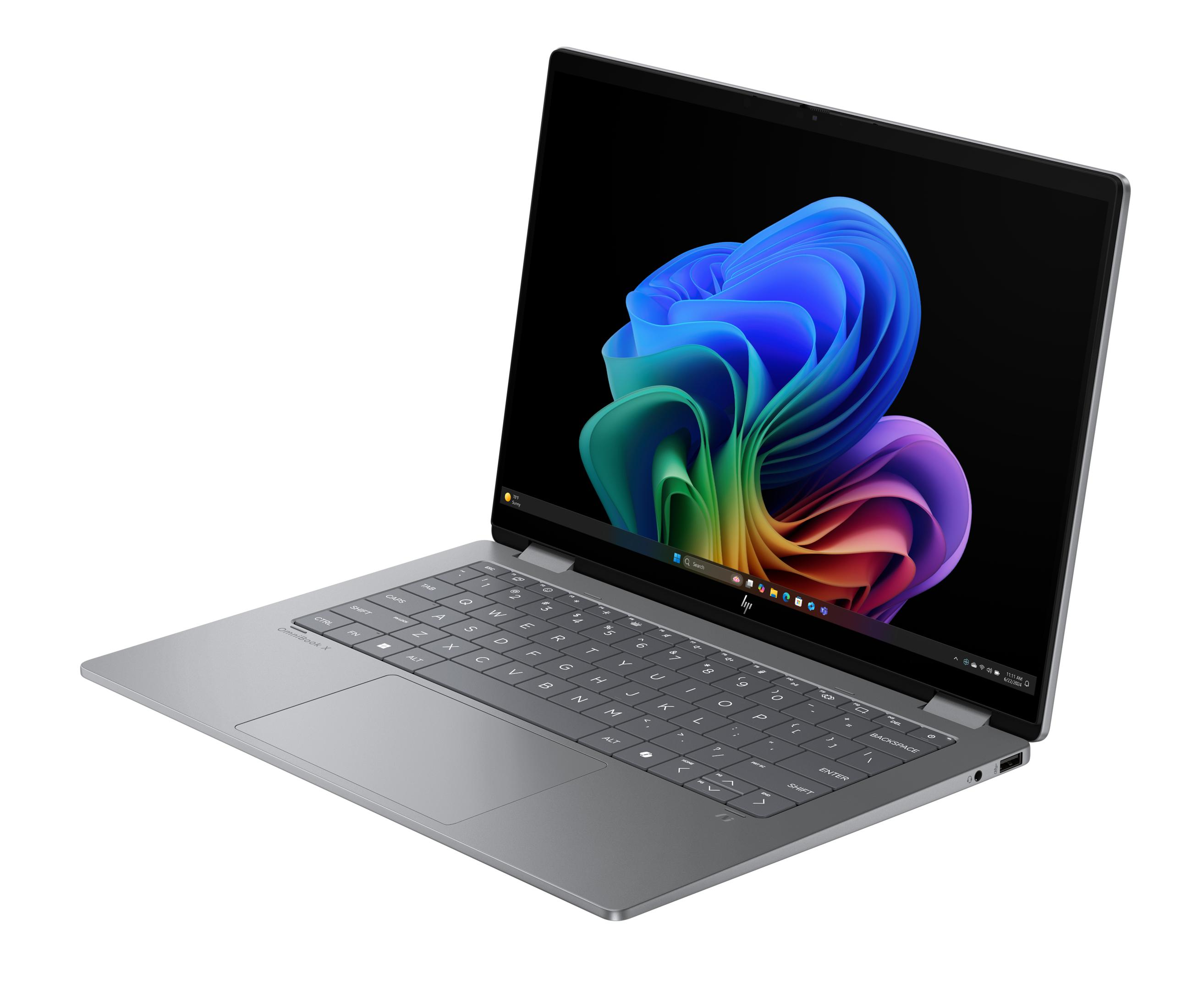 Ein silberner Laptop mit einem bunten Hintergrund auf dem Bildschirm.