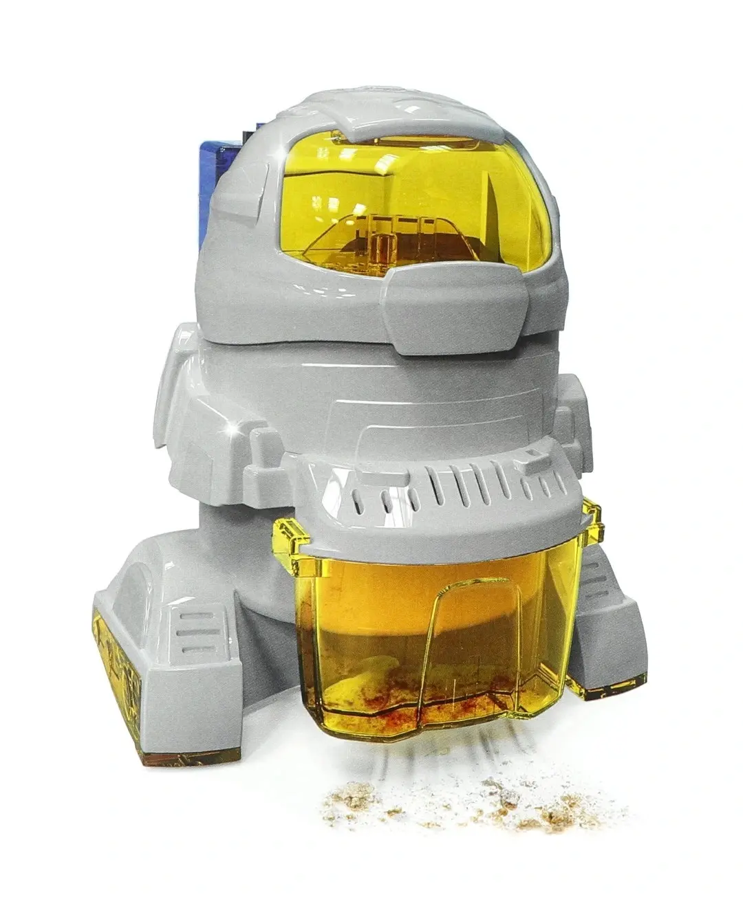 Ein grauer Roboter-Staubsauger mit gelber Haube und transparentem Behälter saugt Krümel auf.