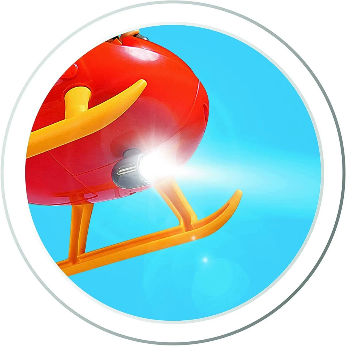 Czerwony i żółty helikopter zabawkawy z jasnym reflektorem.