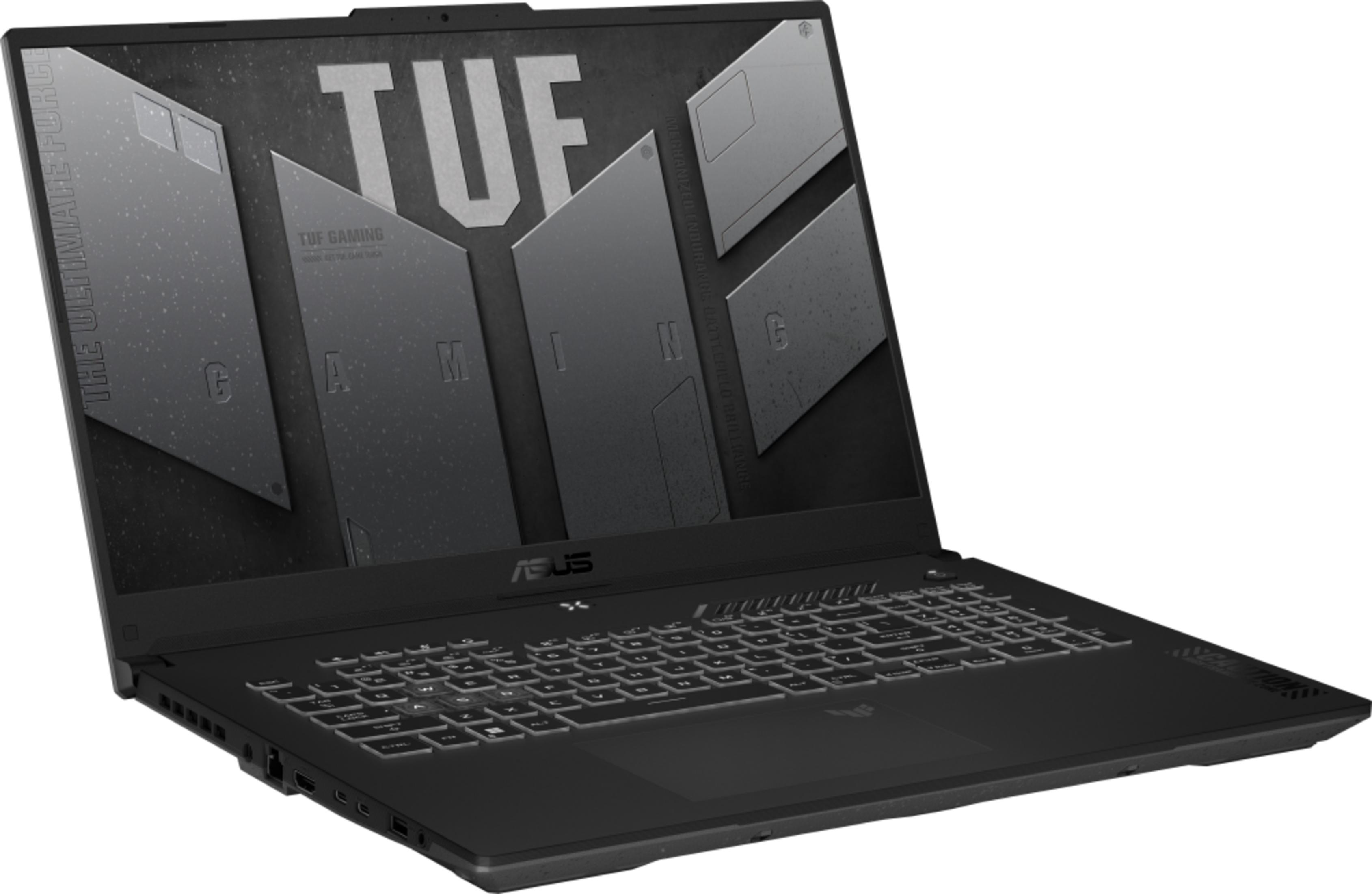 Schwarzer Laptop mit beleuchteter Tastatur und TUF-Gaming-Logo auf dem Bildschirm.