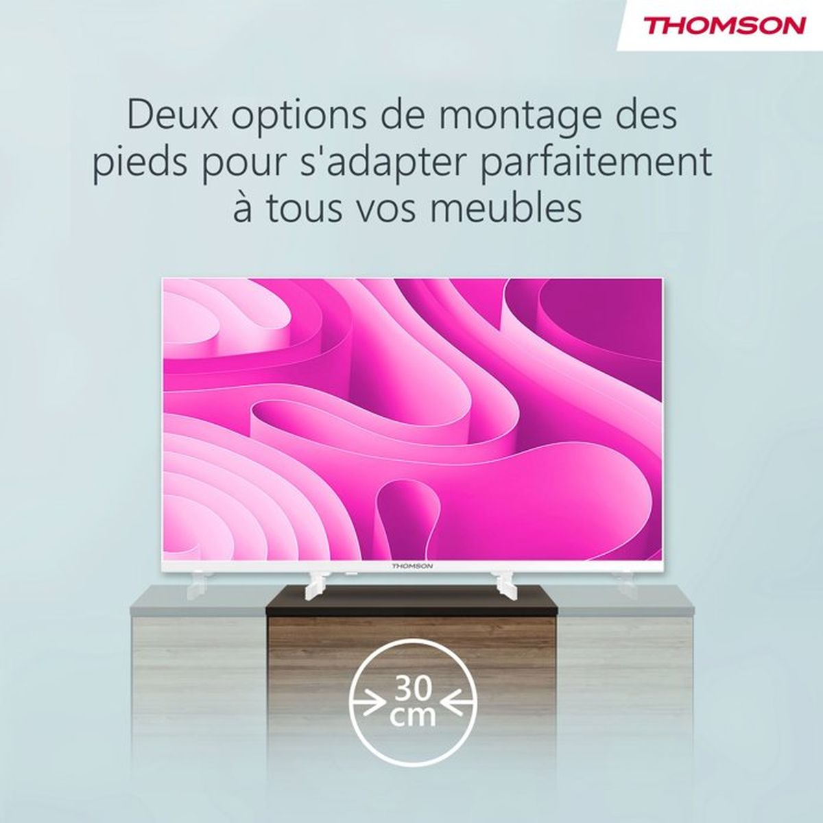 Una TV Thomson su un mobile, con motivo astratto rosa. 30 cm.