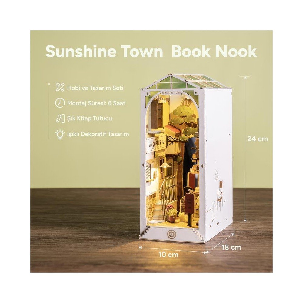 İçinde bir kafe bulunan bir sokak sahnesini gösteren detaylı "Sunshine Town" kitap köşesi modeli.