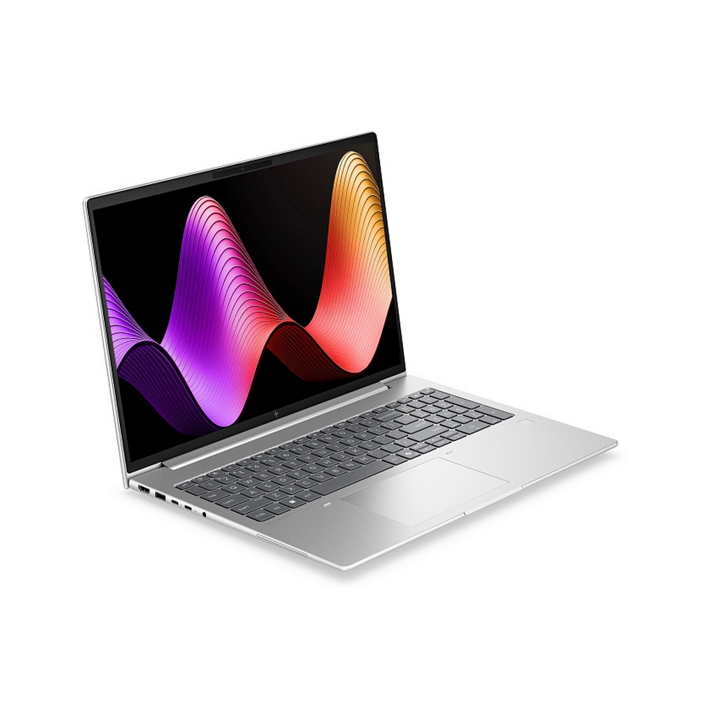 Un laptop argentato con un motivo ondulato colorato sullo schermo.