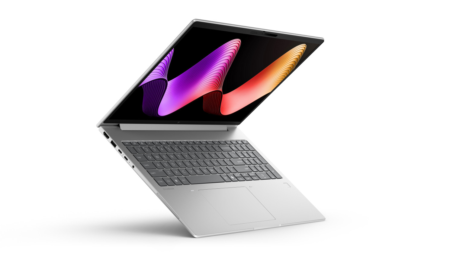 Un laptop argento con uno sfondo astratto colorato visualizzato sullo schermo.