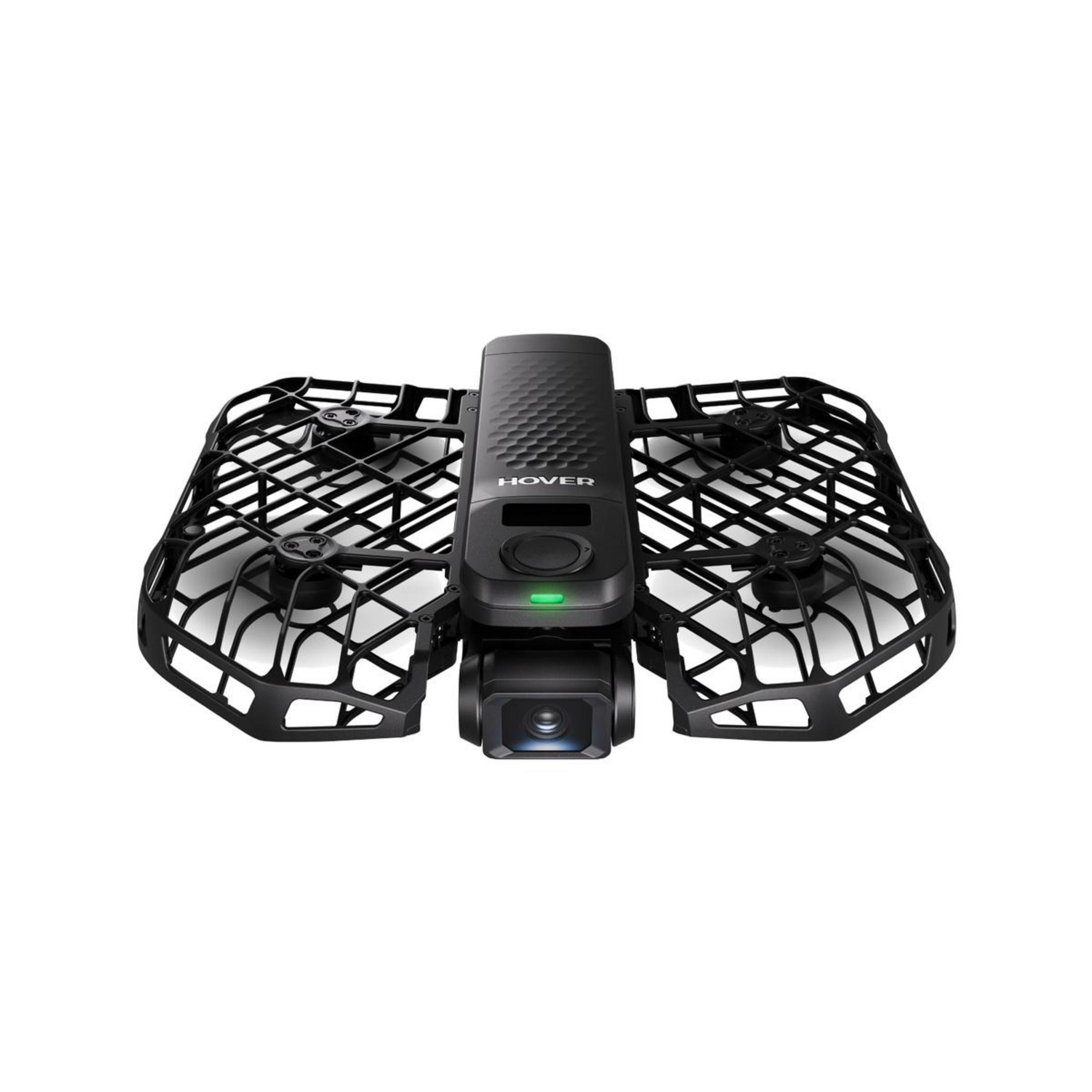 Czarna mini-dron z kamerą i osłonami śmigieł na białym tle.