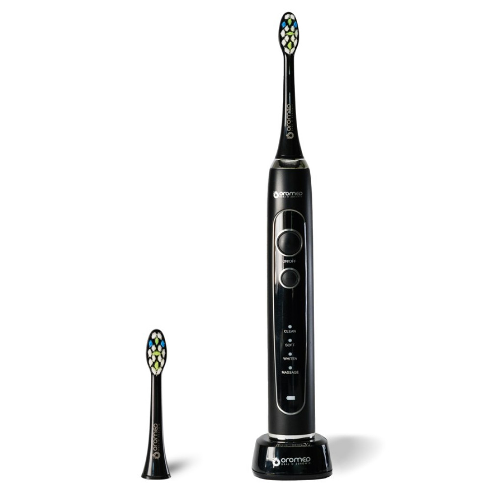 Uno spazzolino elettrico nero con base di ricarica e testina di ricambio.