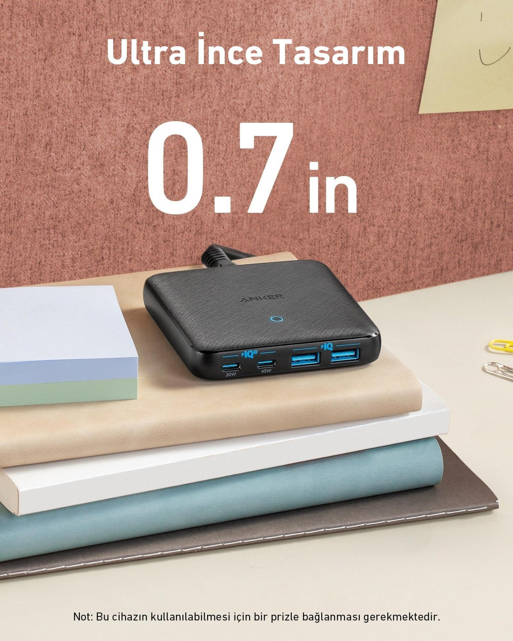 Caricatore Anker nero con 3 porte USB su libri. Testo: Design ultrasottile, 0,7 pollici.