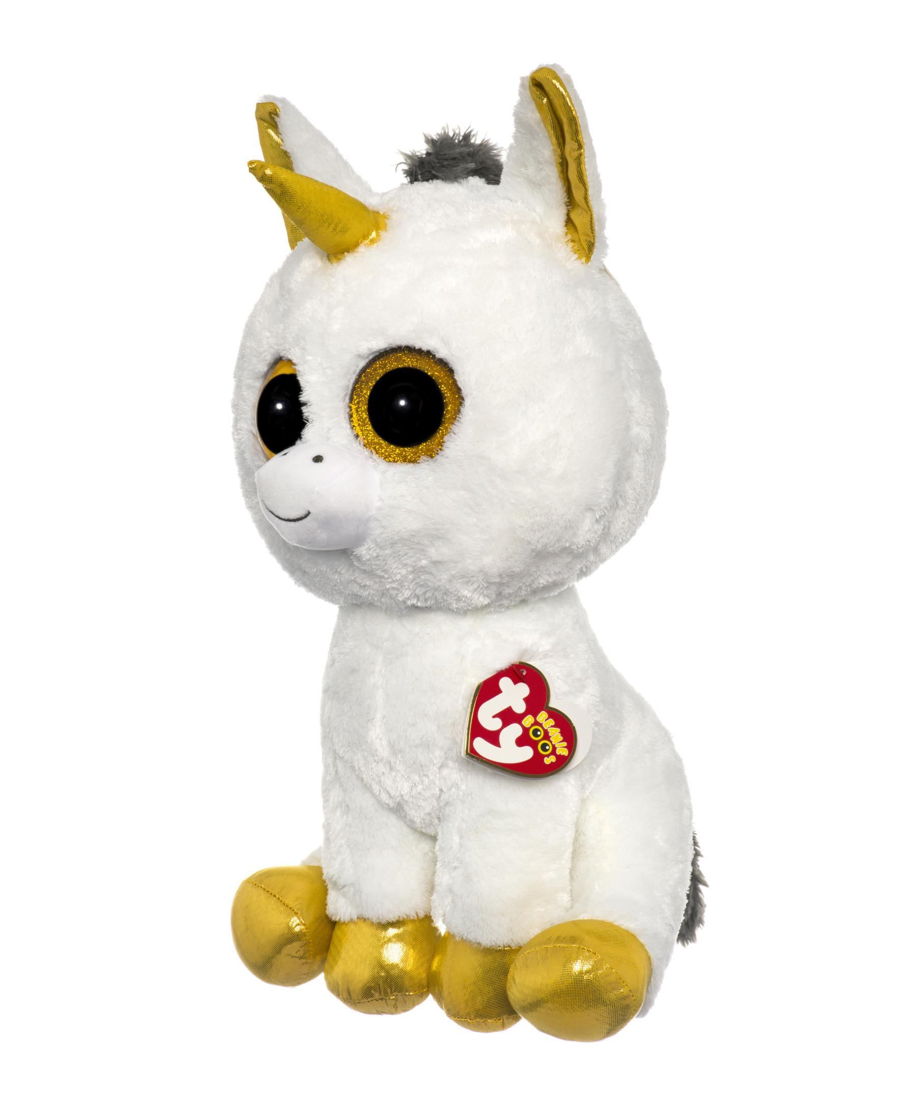 A white plush unicorn with a gold horn and ears sits.