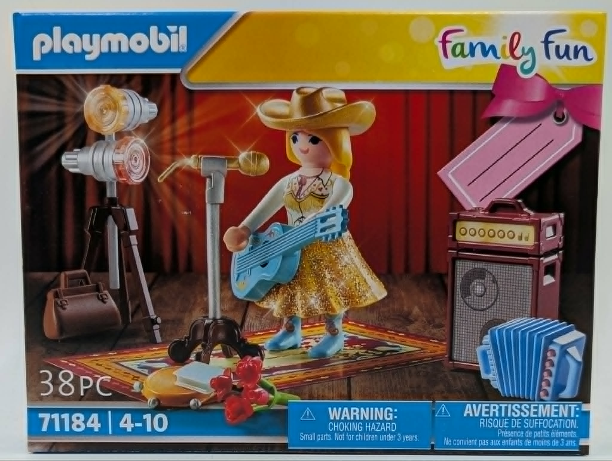 Zestaw Playmobil z figurką kowbojki, gitarą, mikrofonem, wzmacniaczem, akordeonem.