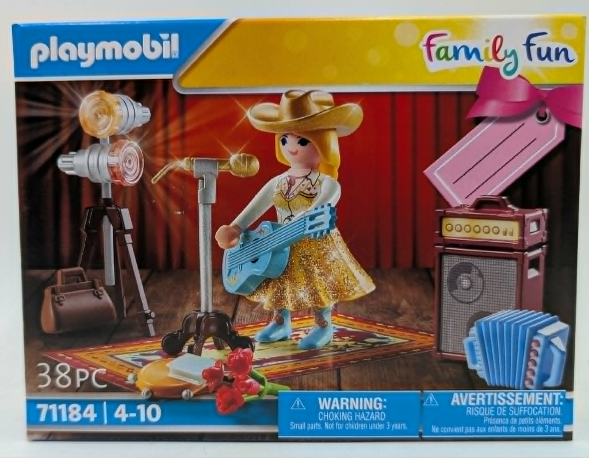 Zestaw Playmobil z kowbojką grającą na gitarze, mikrofonem, wzmacniaczem i akordeonem.