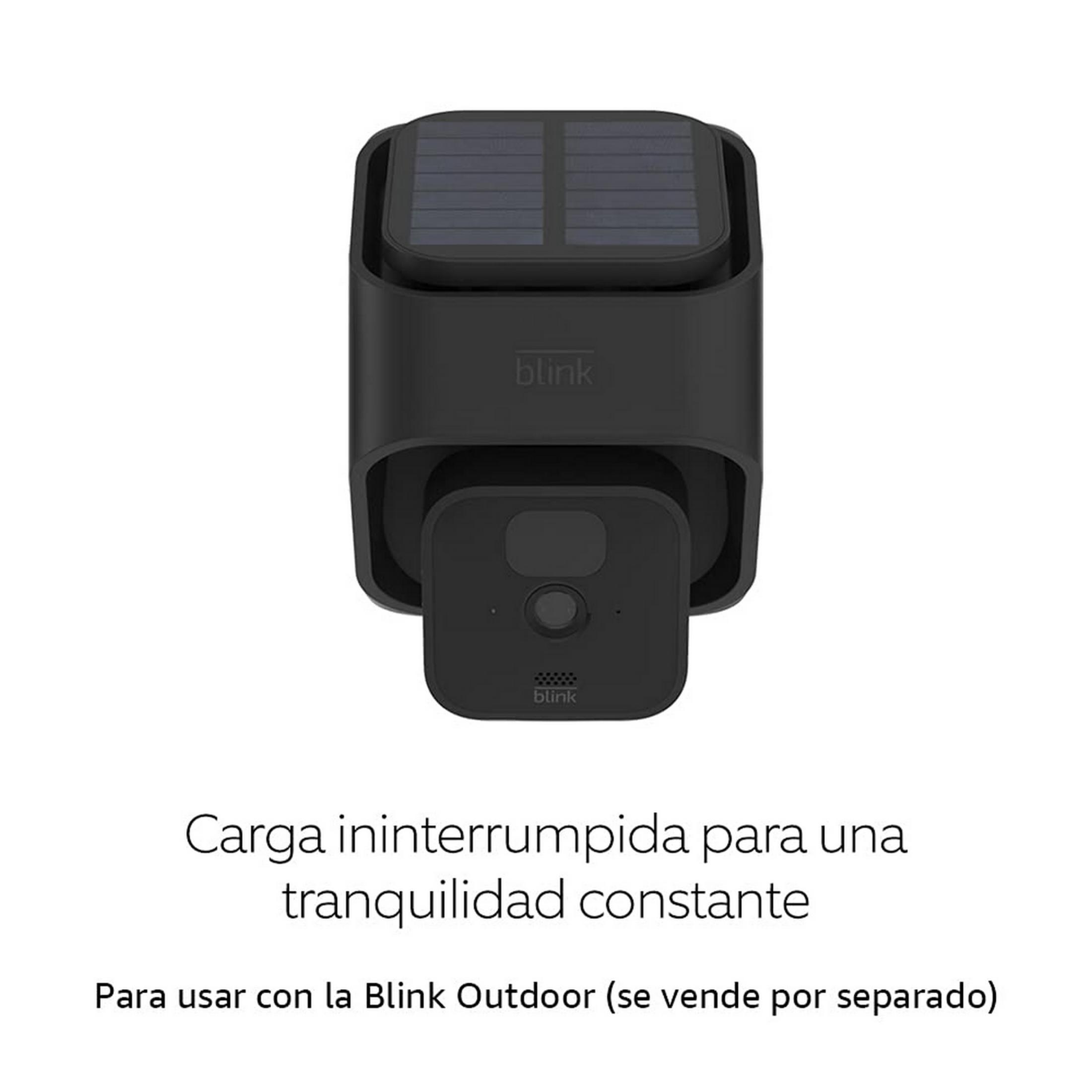 Caricabatterie solare Blink nero con una fotocamera.