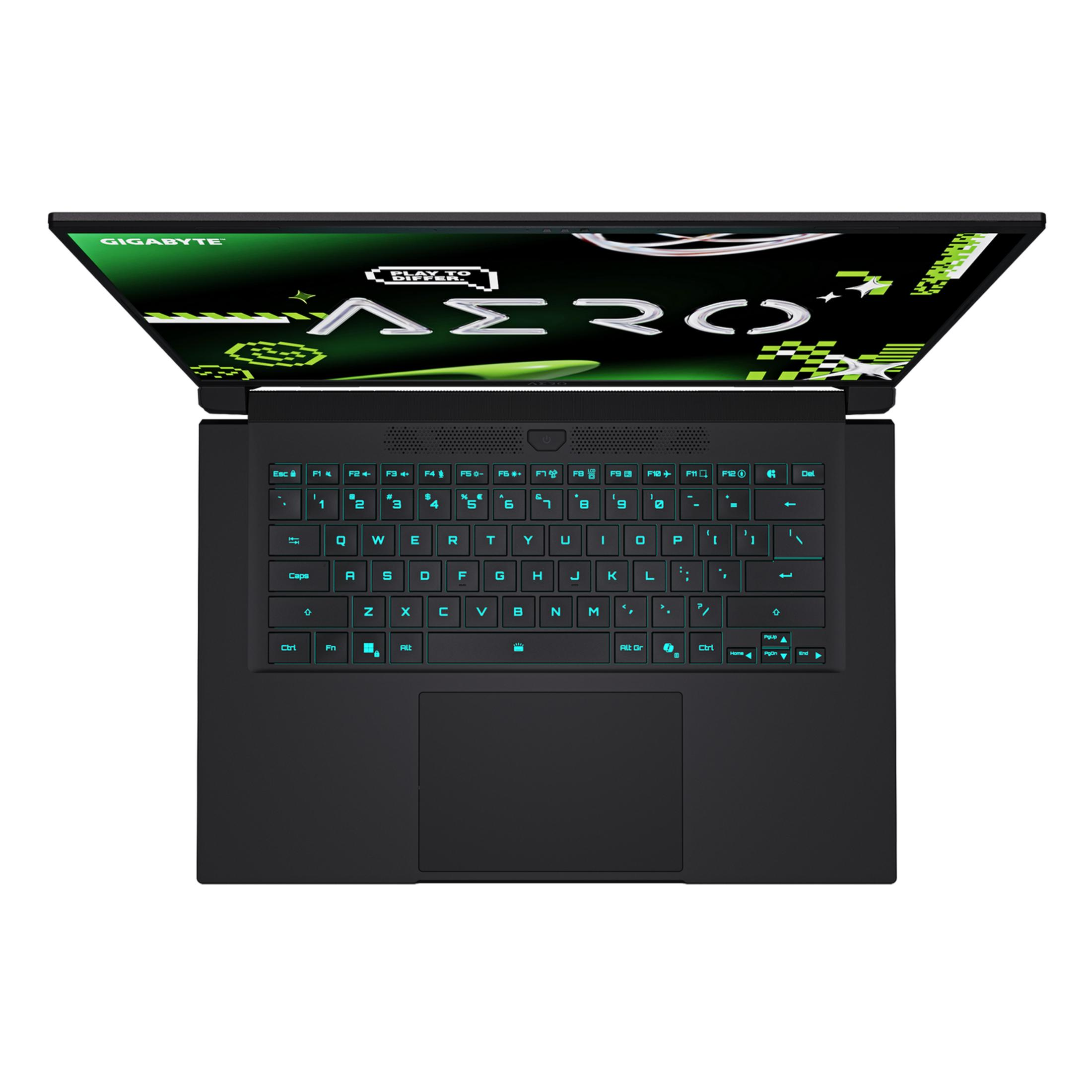 Un portátil negro está abierto. La pantalla muestra gráficos verdes. El teclado tiene retroiluminación azul.