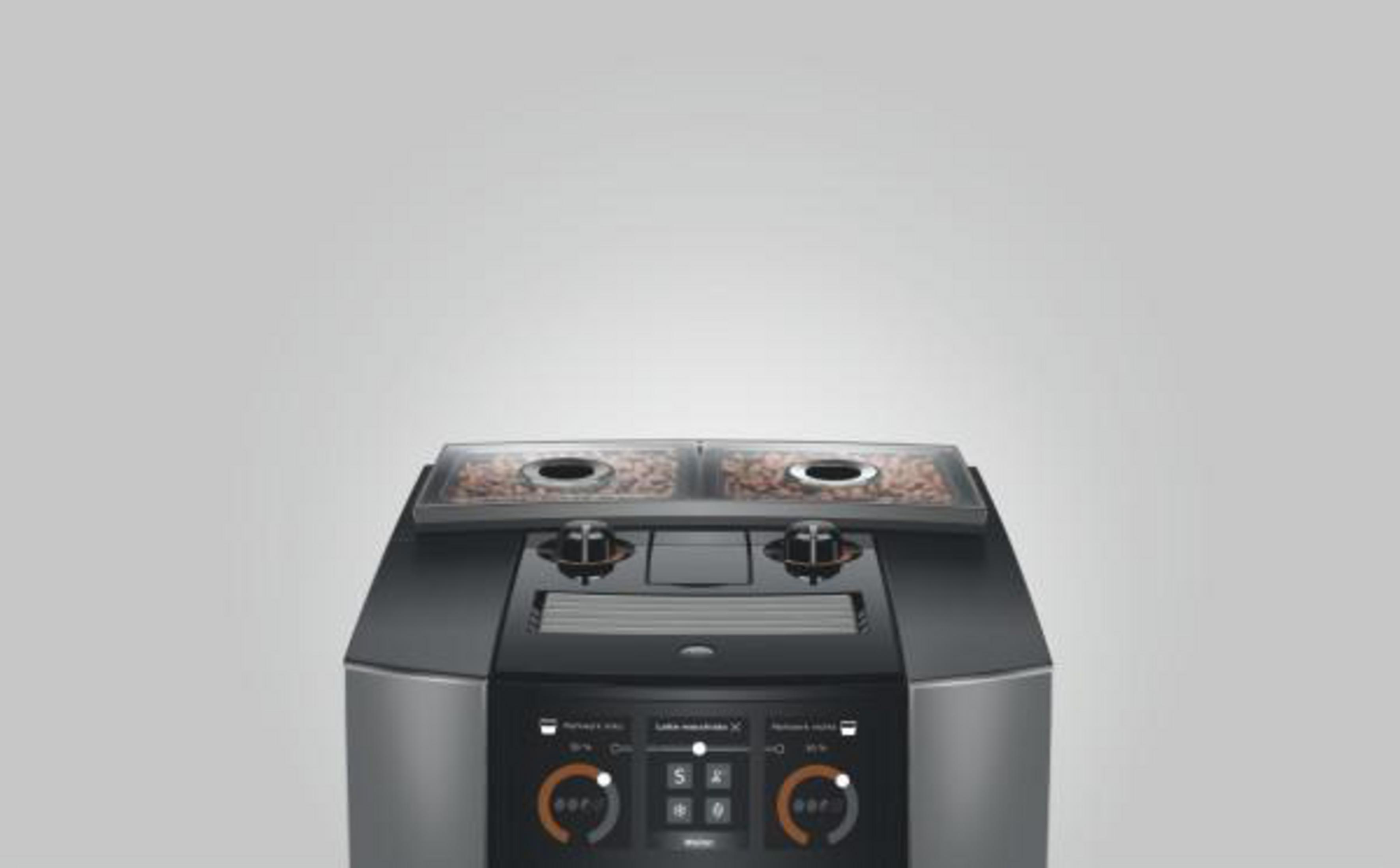 Macchina da caffè con due contenitori per chicchi e pannello touch.