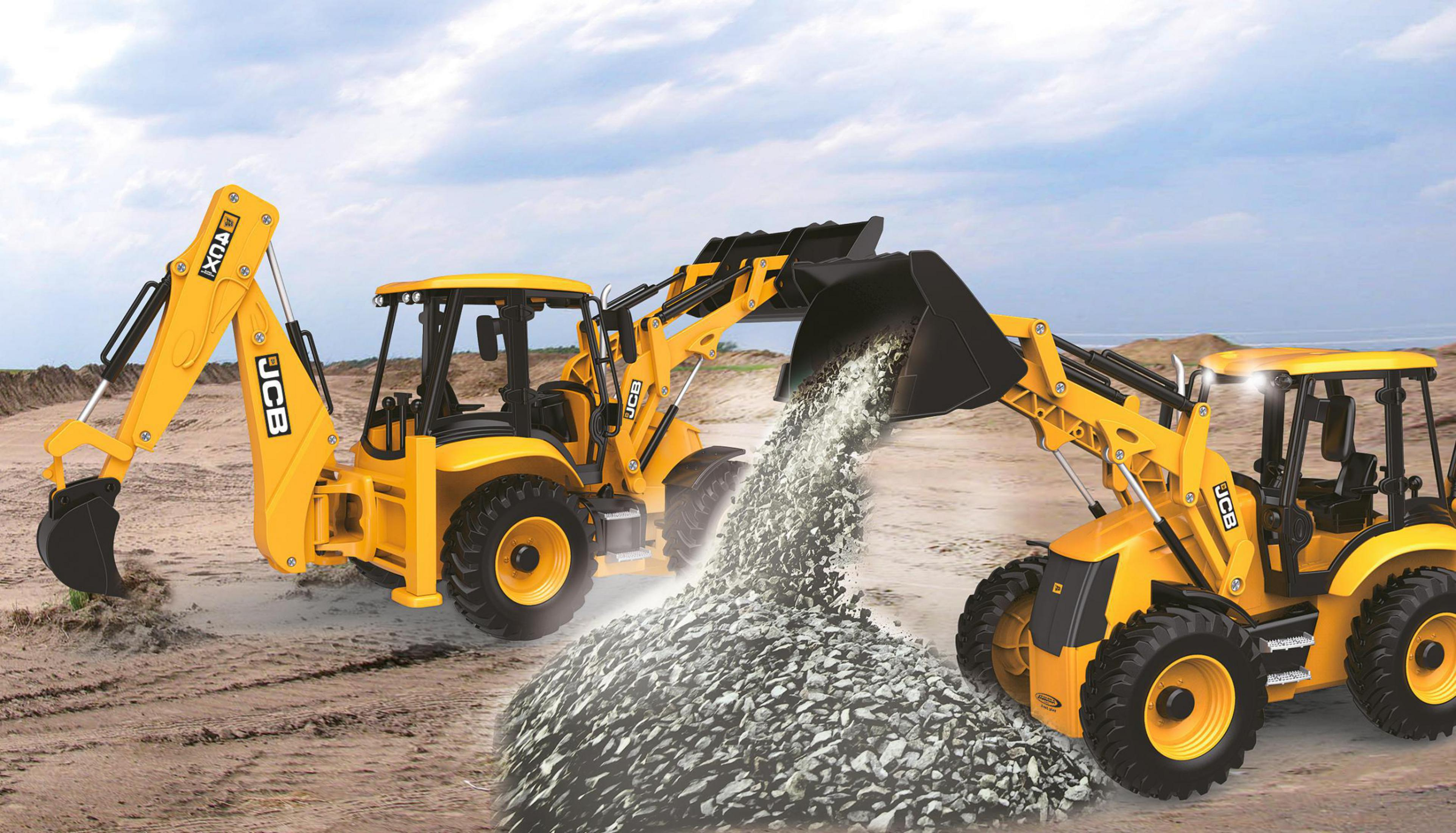 Zwei gelbe Bagger arbeiten auf einer Baustelle, einer schüttet Kies.