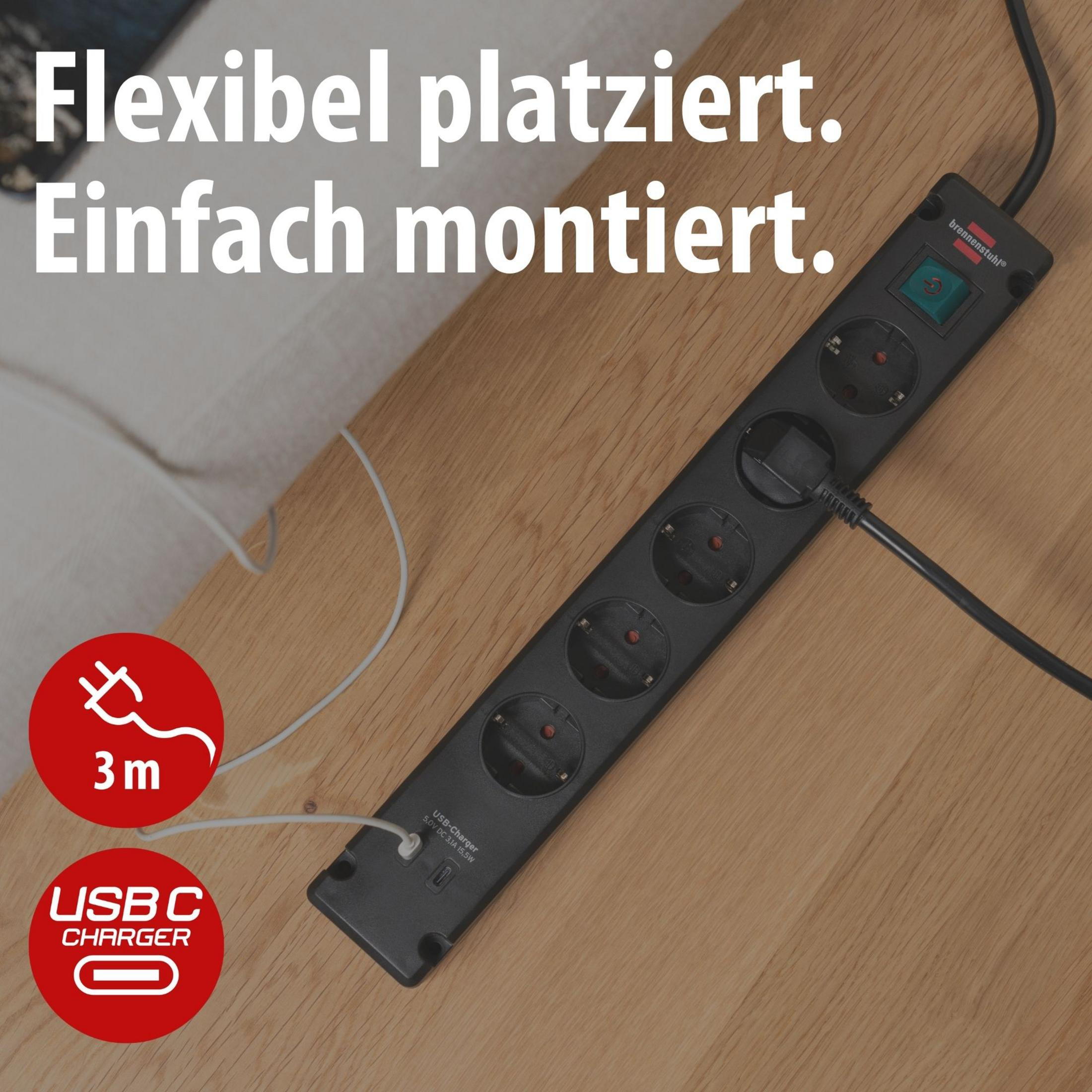 Ciabatta nera con 5 prese e porta di ricarica USB-C su tavolo di legno.