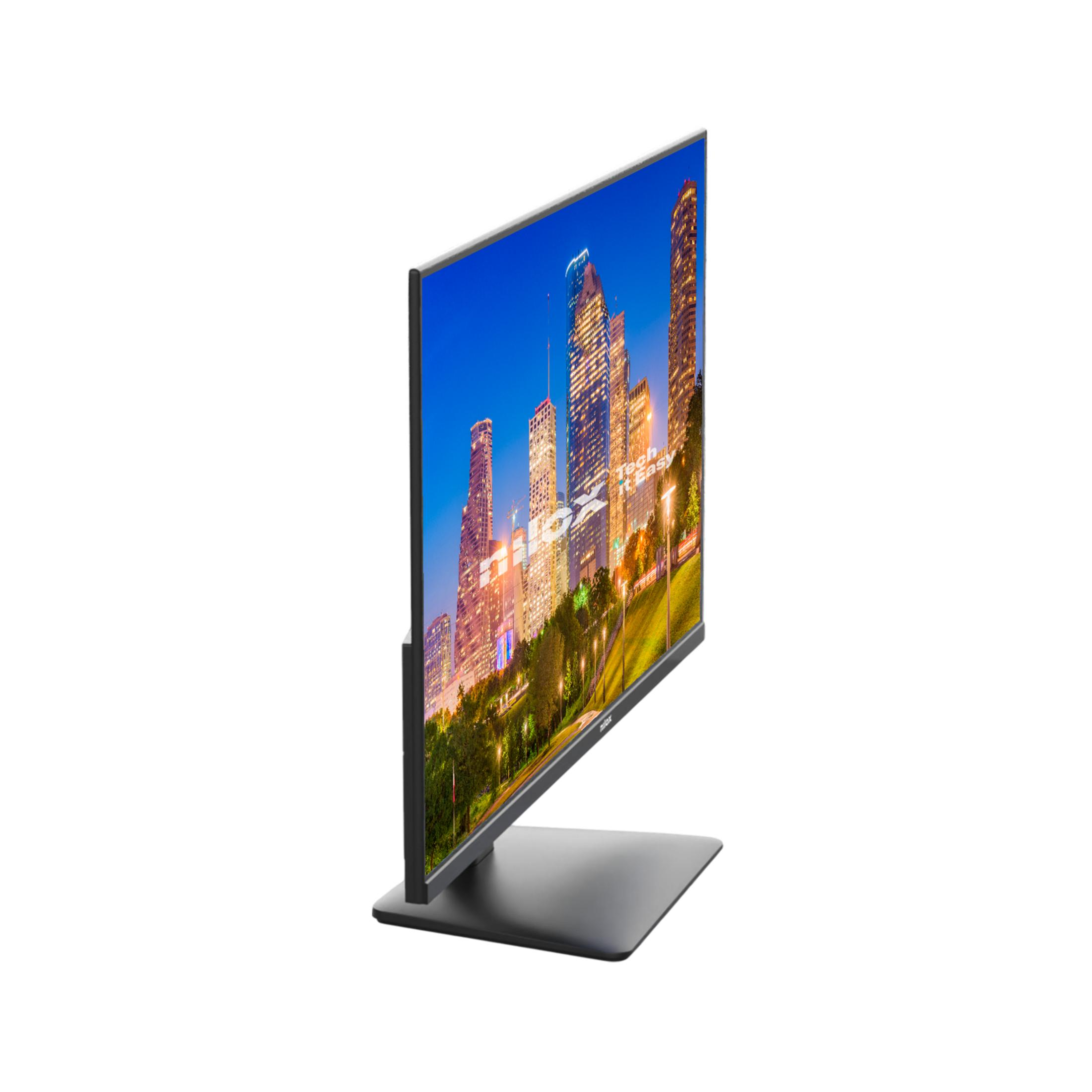 Un monitor moderno muestra un horizonte urbano nocturno con rascacielos iluminados.