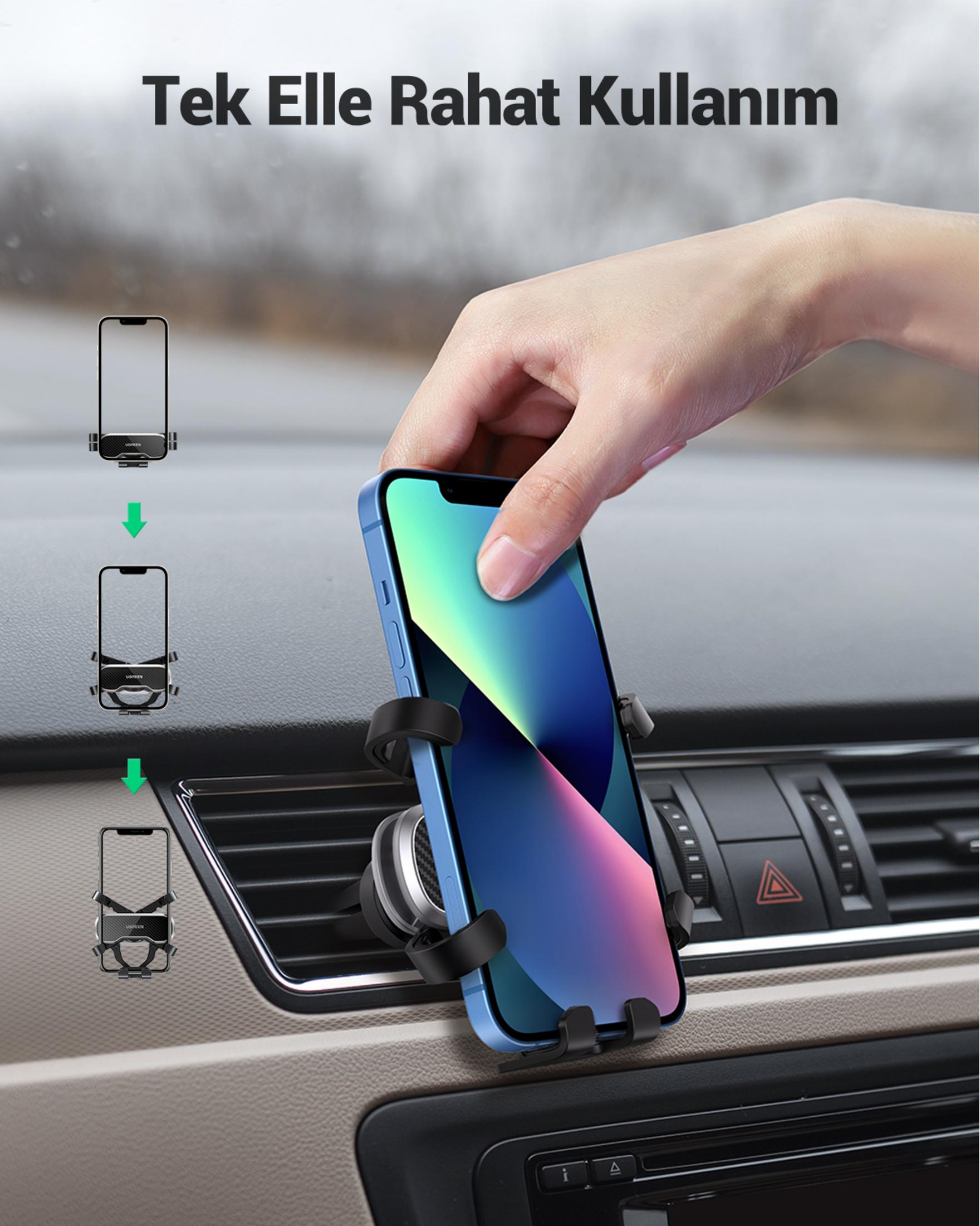 Una mano inserisce uno smartphone blu in un supporto per auto su una presa d'aria.