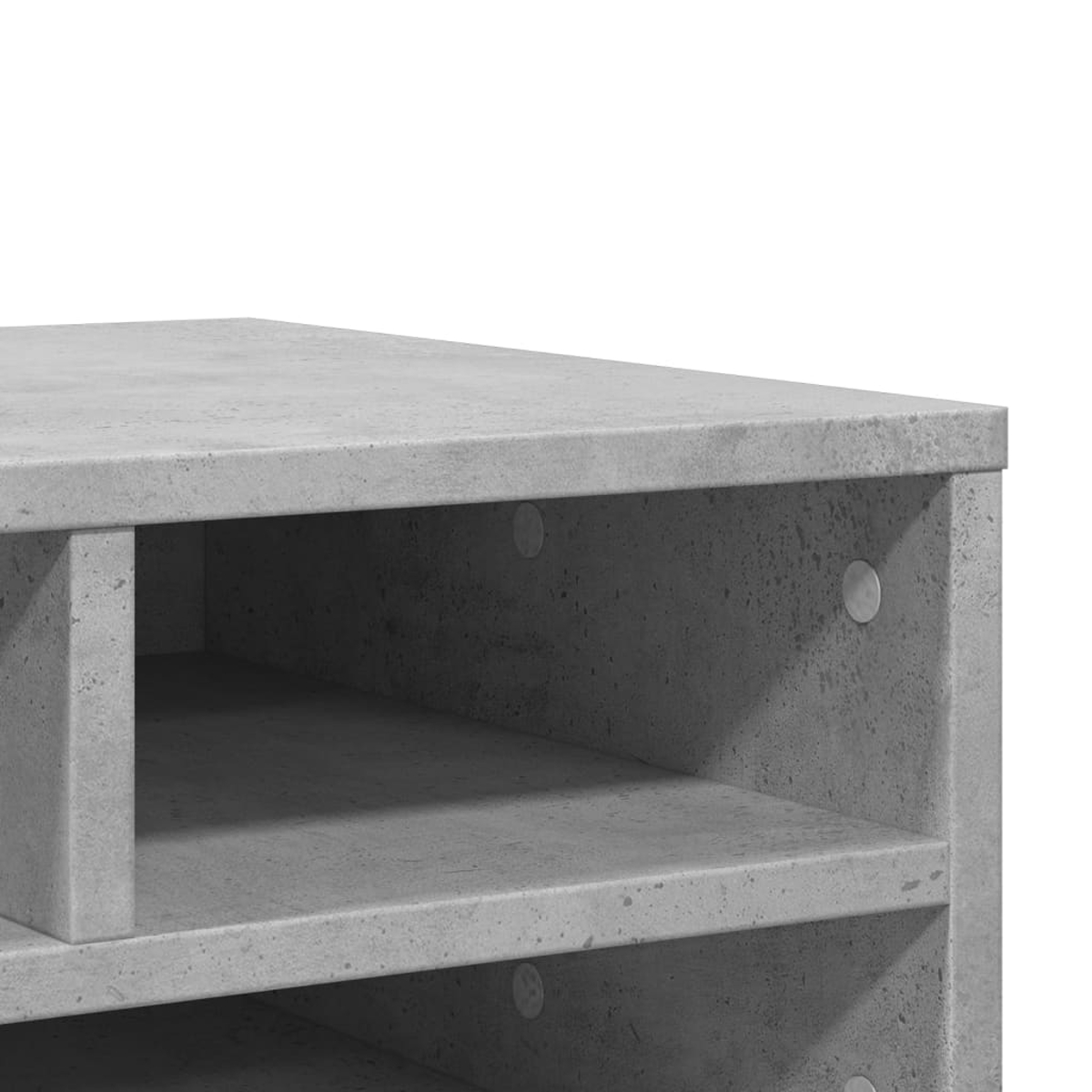 Grauer Beton-Regal mit offenen Fächern und silbernen Bolzen.