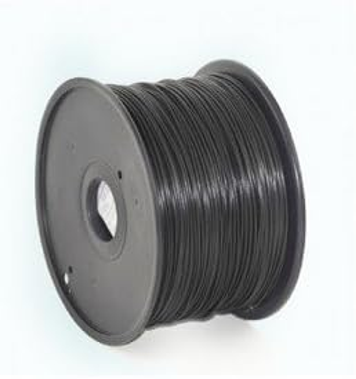 Eine Spule mit schwarzem 3D-Druckfilament auf grauem Hintergrund.