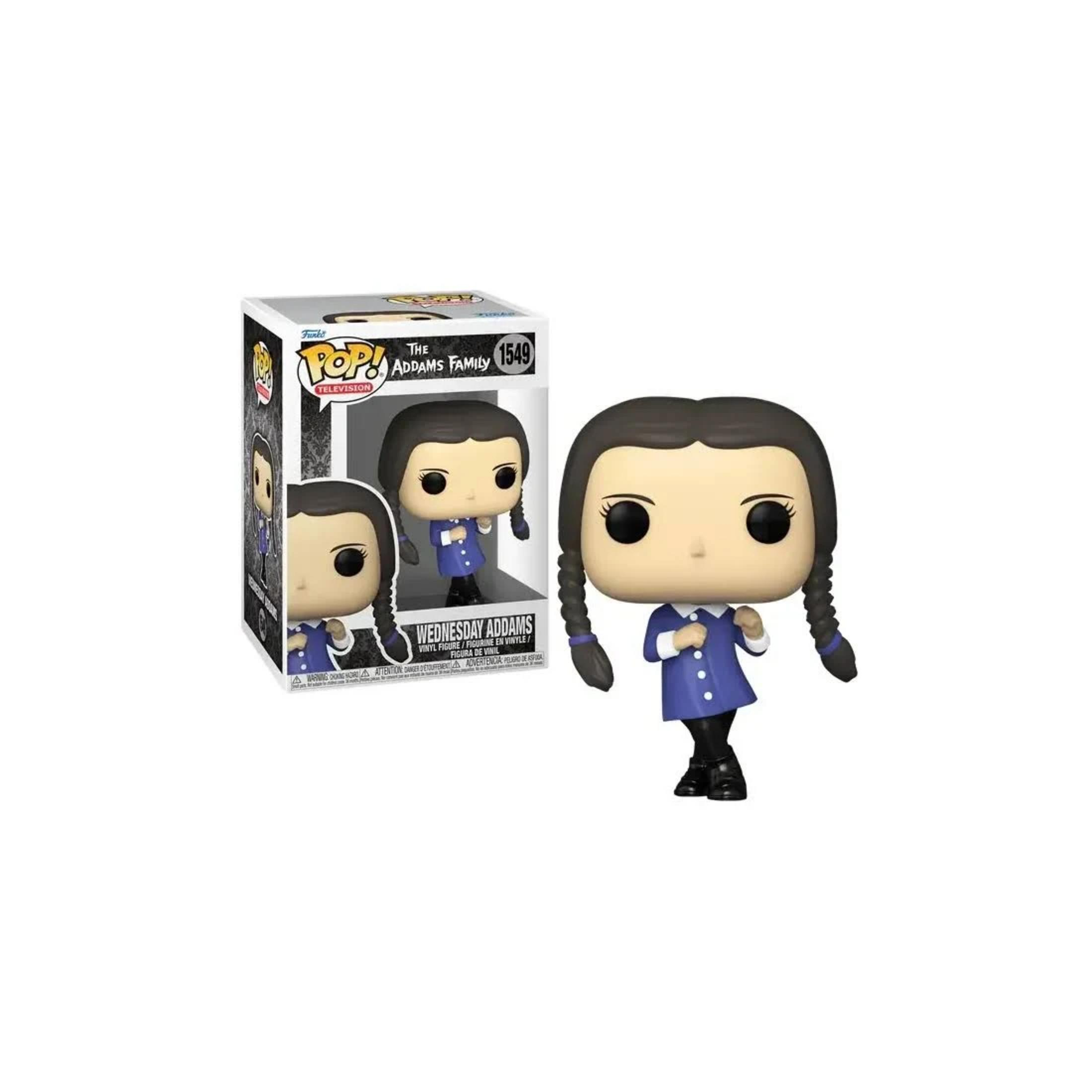 Statua Funko Pop! di Mercoledì Addams in uniforme blu accanto alla sua scatola.