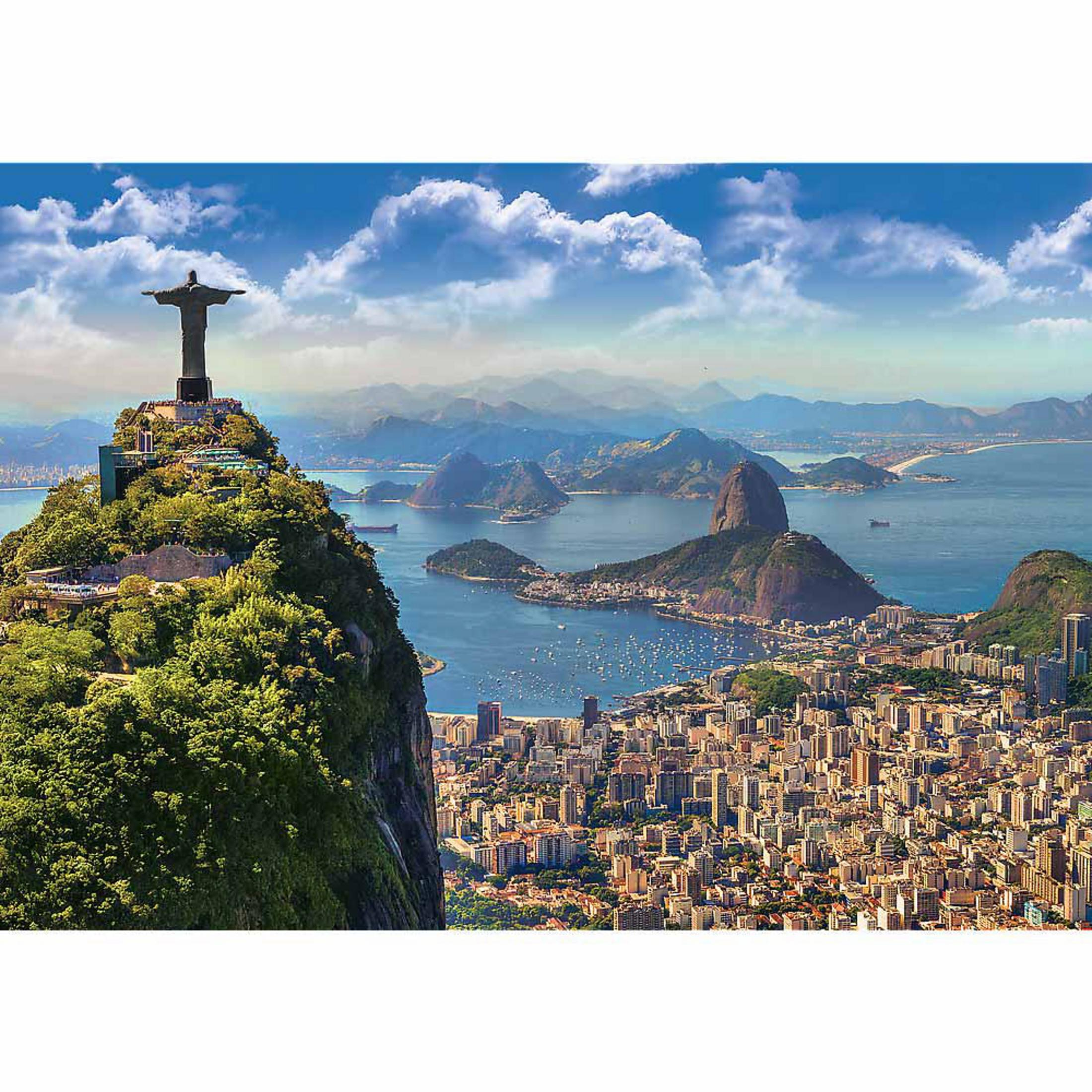 Estatua de Cristo Redentor con vistas a Río de Janeiro y el Pan de Azúcar.