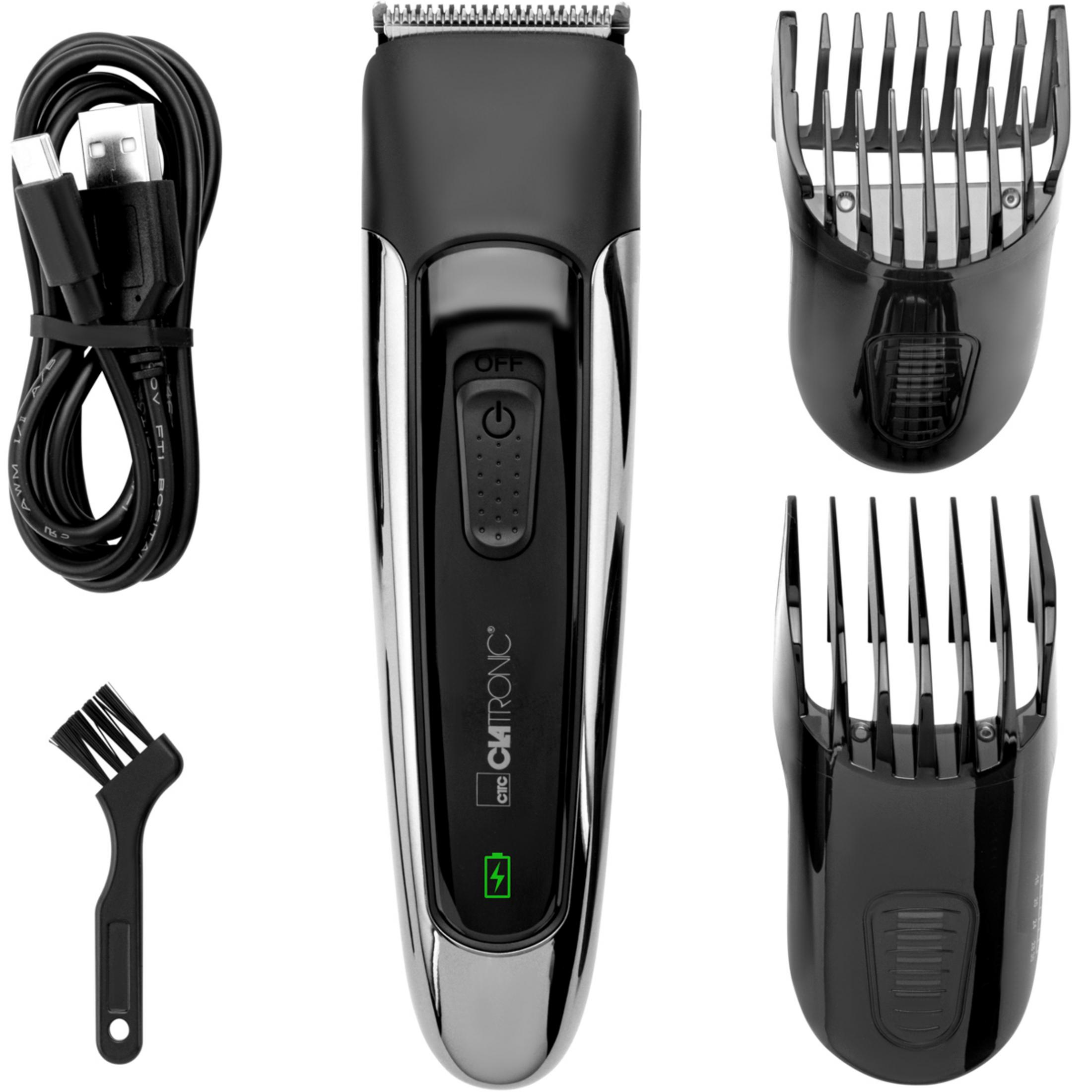 Ein schwarzer Haarschneider mit Zubehör: USB-Kabel, Bürste und zwei Aufsätze.