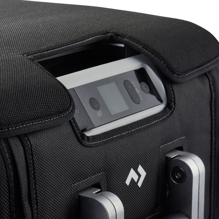 Black fabric case with a digital display and buttons on a device inside.