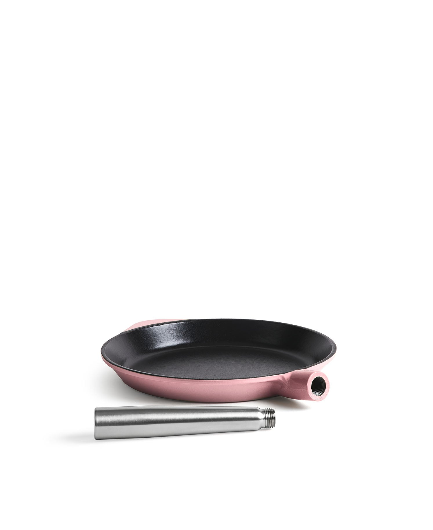 Sartén de hierro fundido rosa con mango desmontable sobre fondo blanco.