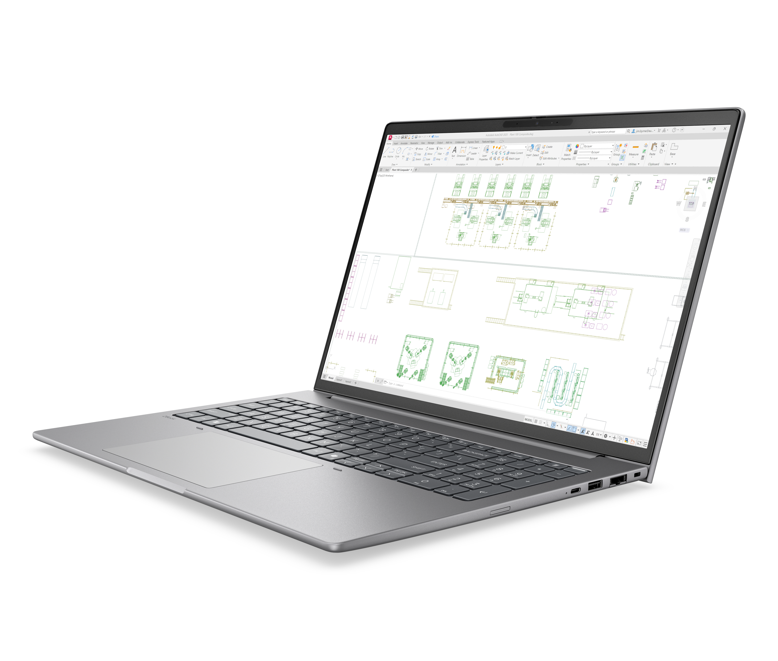 Un laptop argentato che mostra un progetto tecnico sullo schermo.