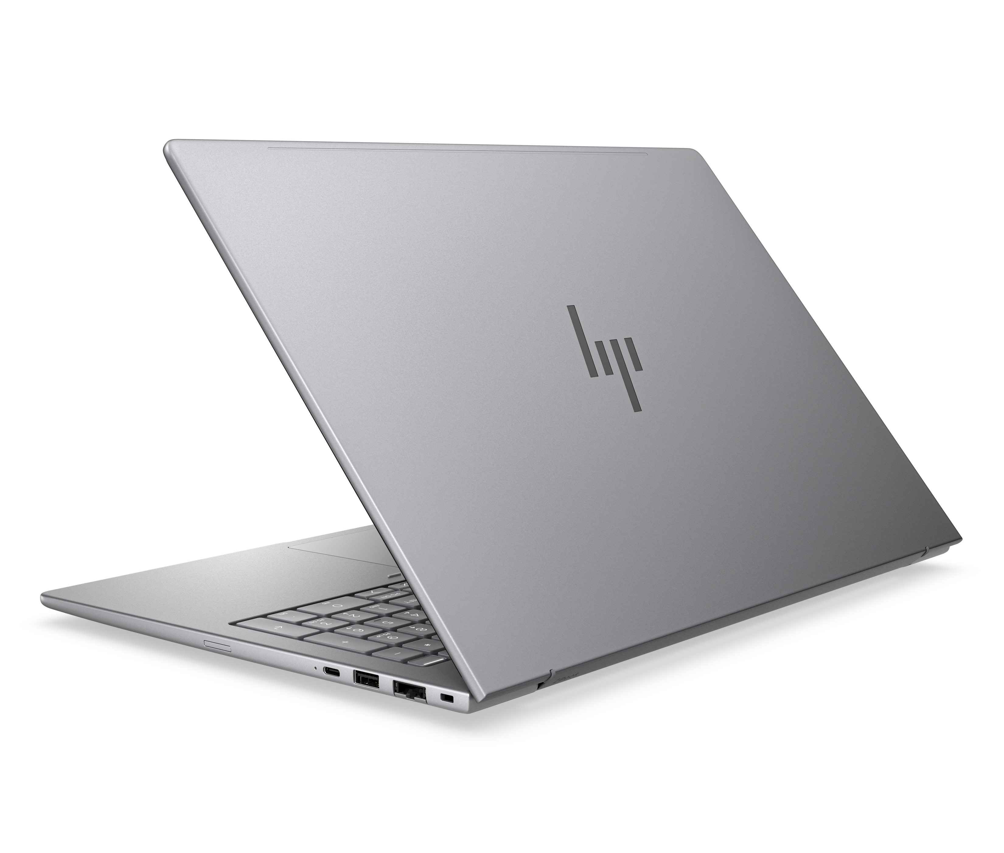 Un laptop HP argento è aperto, con tastiera e porte visibili.