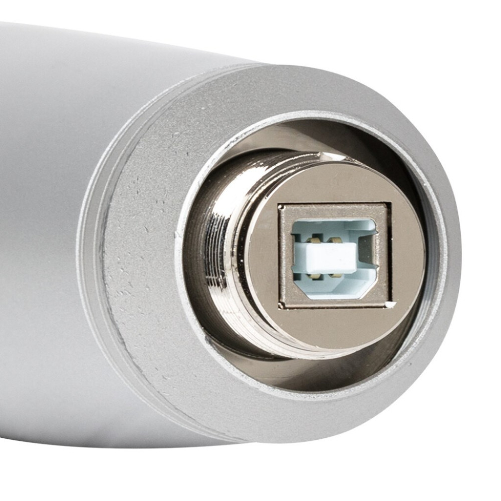 Zbliżenie srebrnego portu USB-B na cylindrycznym obiekcie.