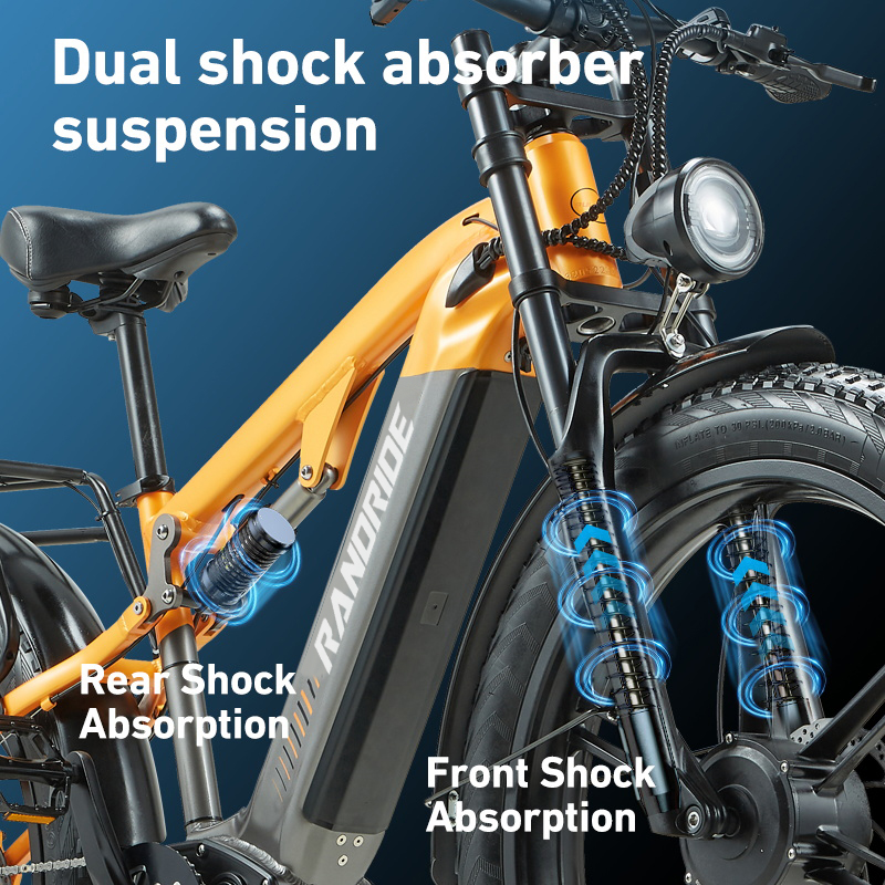 Orange E-Bike mit Vorder- und Hinterradfederung und blauen Absorptionsanzeigen.