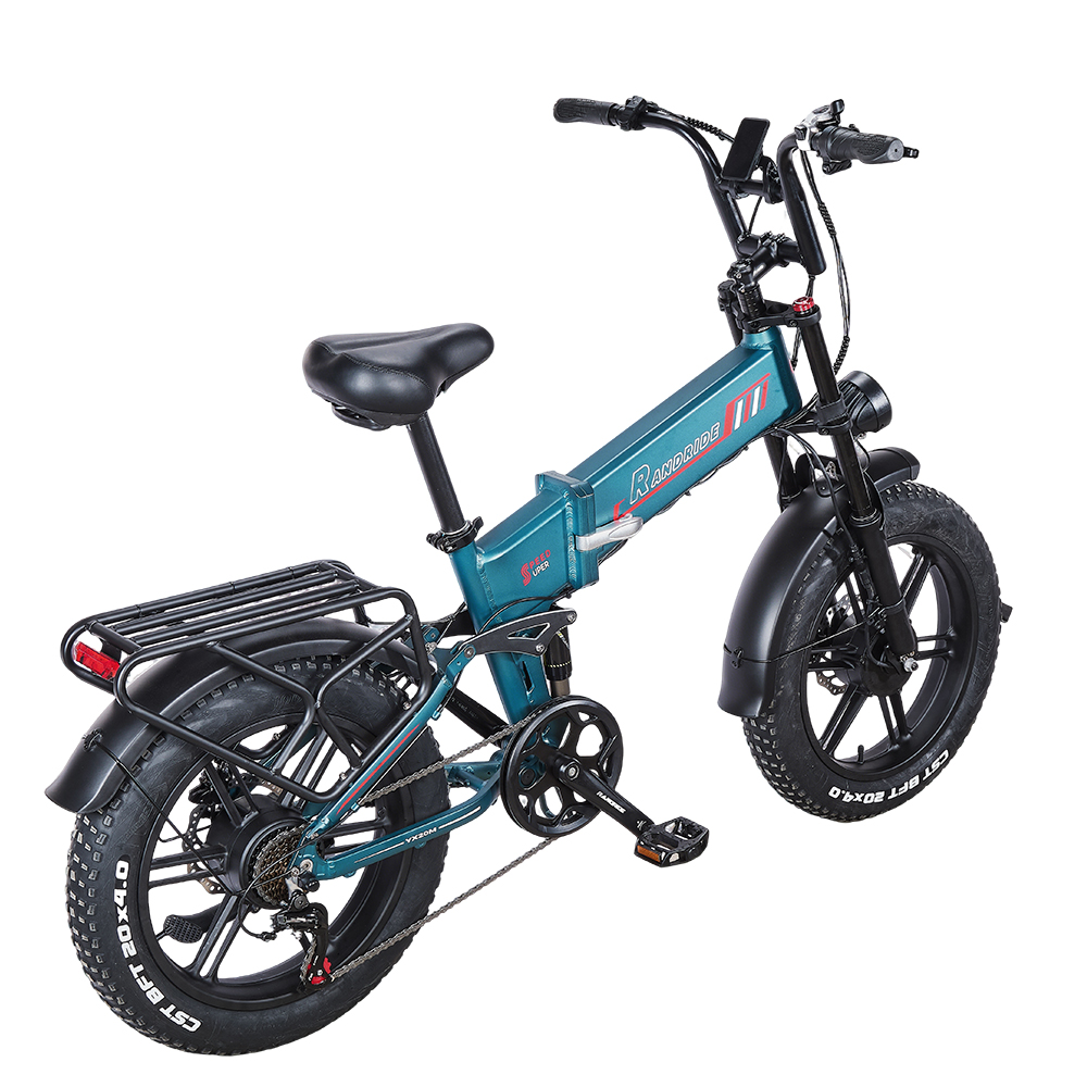 Ein türkisfarbener Falt-E-Bike mit fetten Reifen und Gepäckträger.