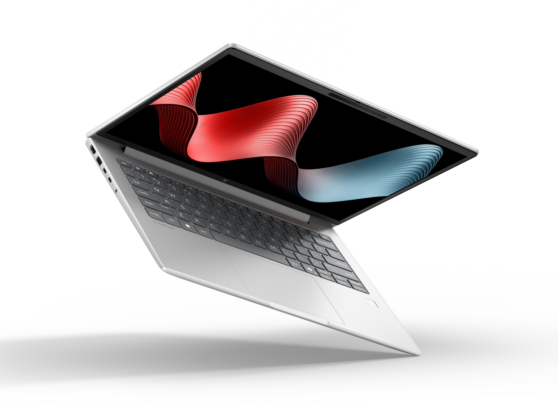 Un laptop argentato mostra un nastro stilizzato rosso e blu sul suo schermo.
