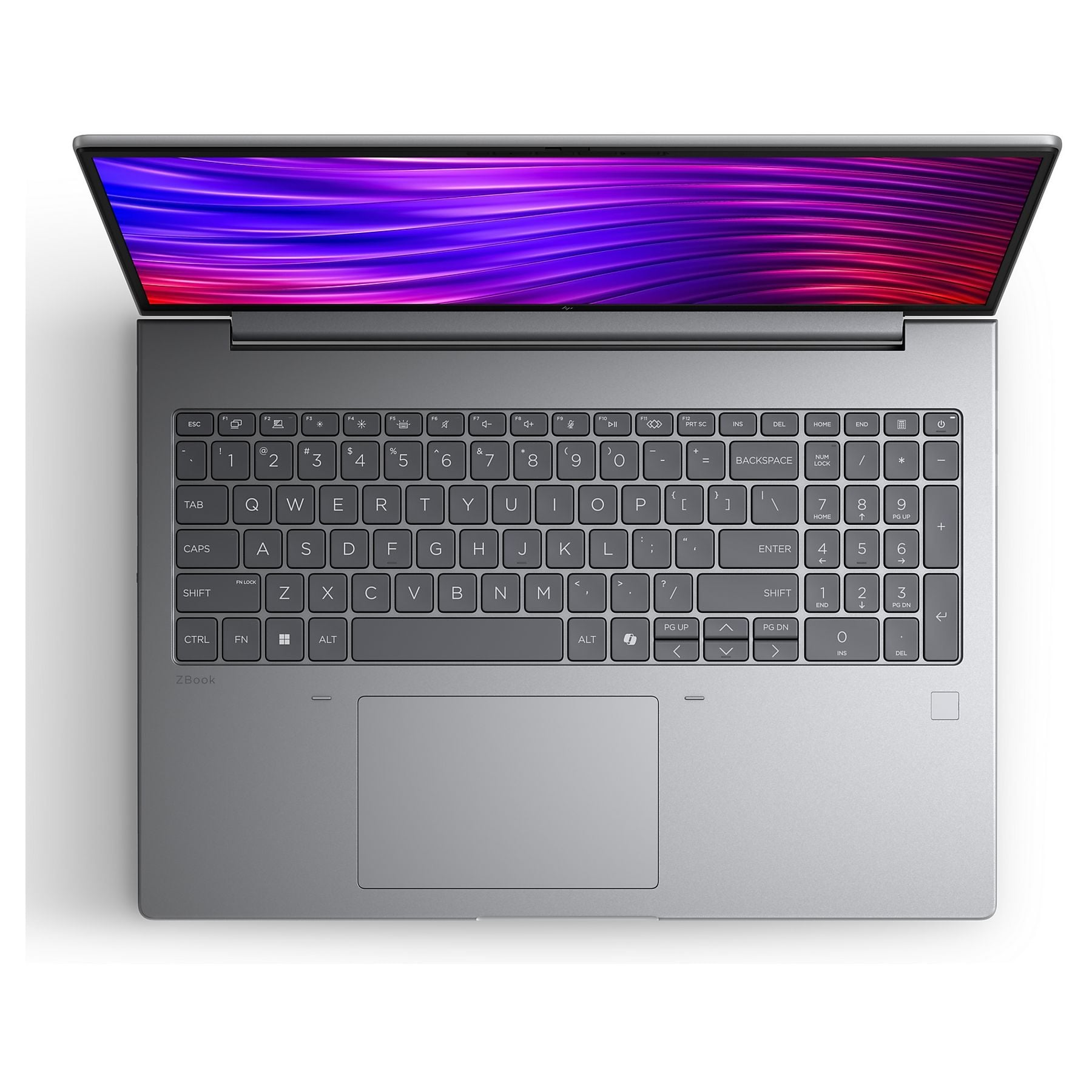 Un laptop argentato con il coperchio aperto, schermo colorato acceso.