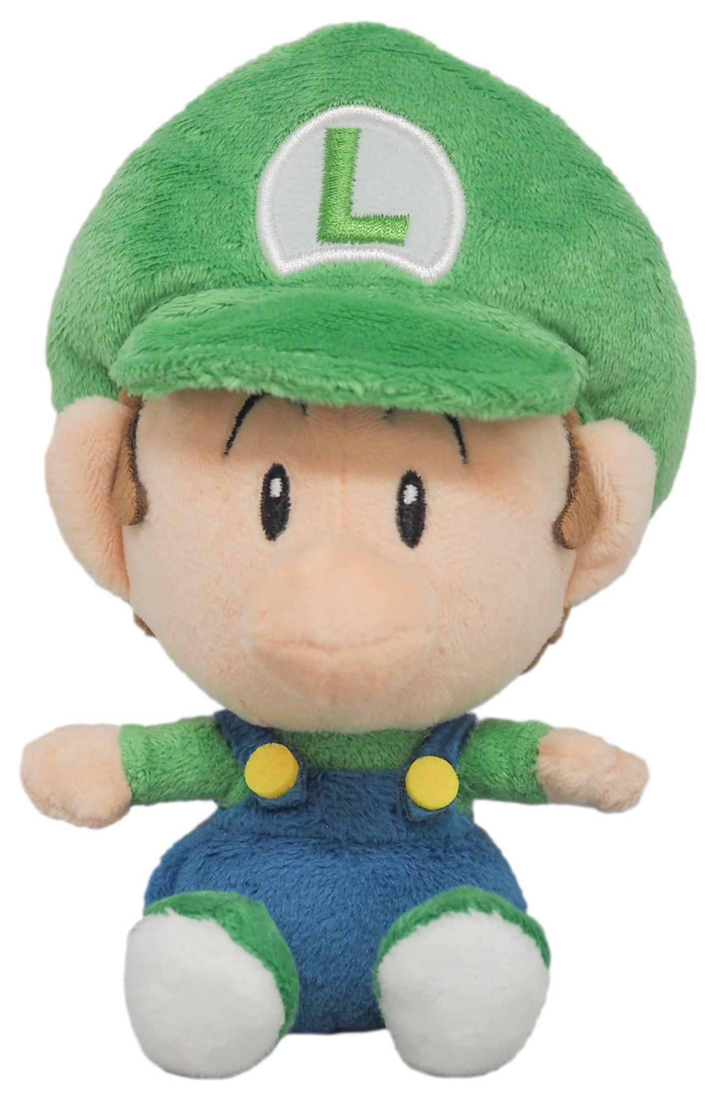 Ein Baby Luigi Plüschtier mit grüner Mütze, L-Logo, blauer Latzhose und weißen Schuhen.