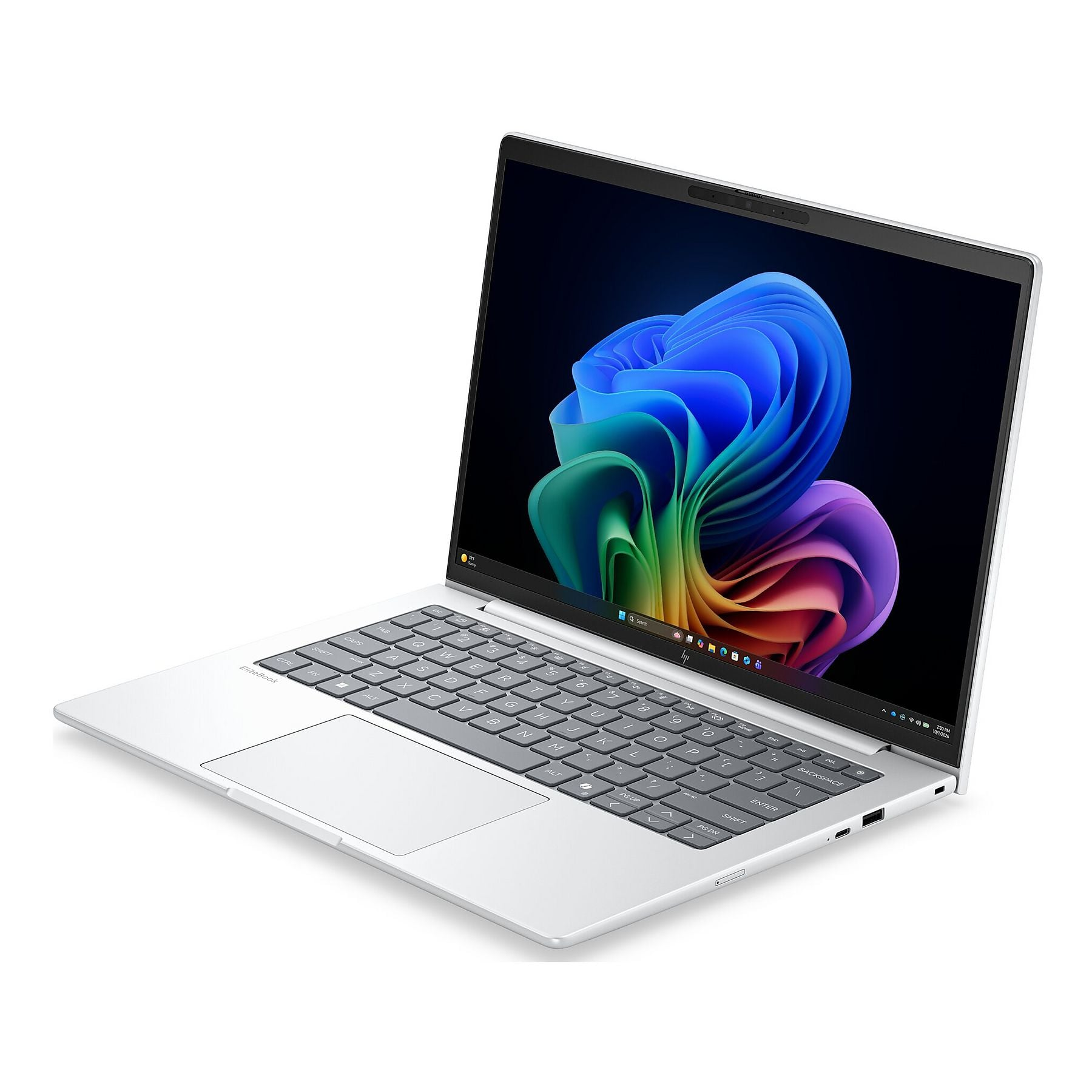 Un laptop argentato con uno sfondo astratto colorato sullo schermo.