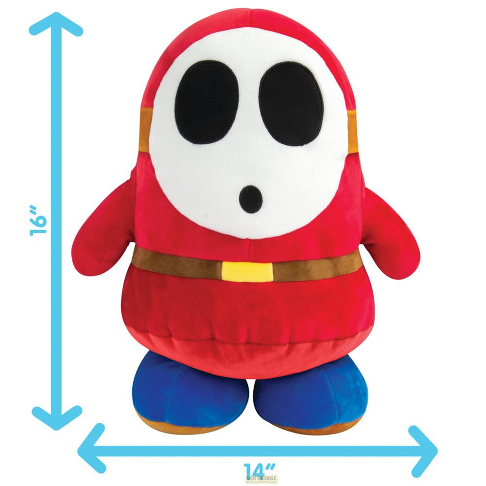 Peluche rosso Shy Guy con maschera bianca, cintura marrone e scarpe blu.