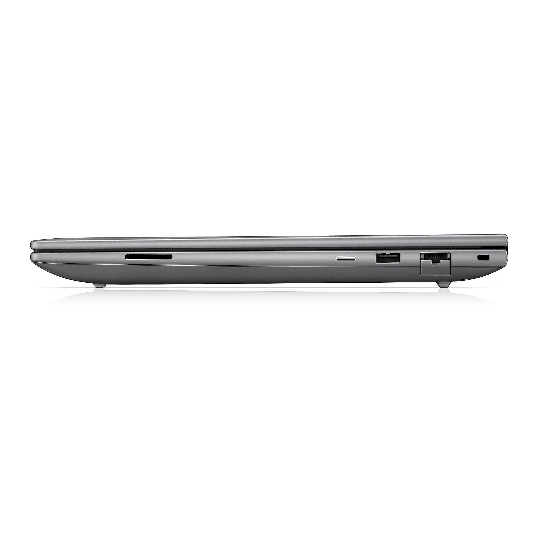 Vista laterale di laptop grigio con porte: lettore SD, USB, Ethernet.
