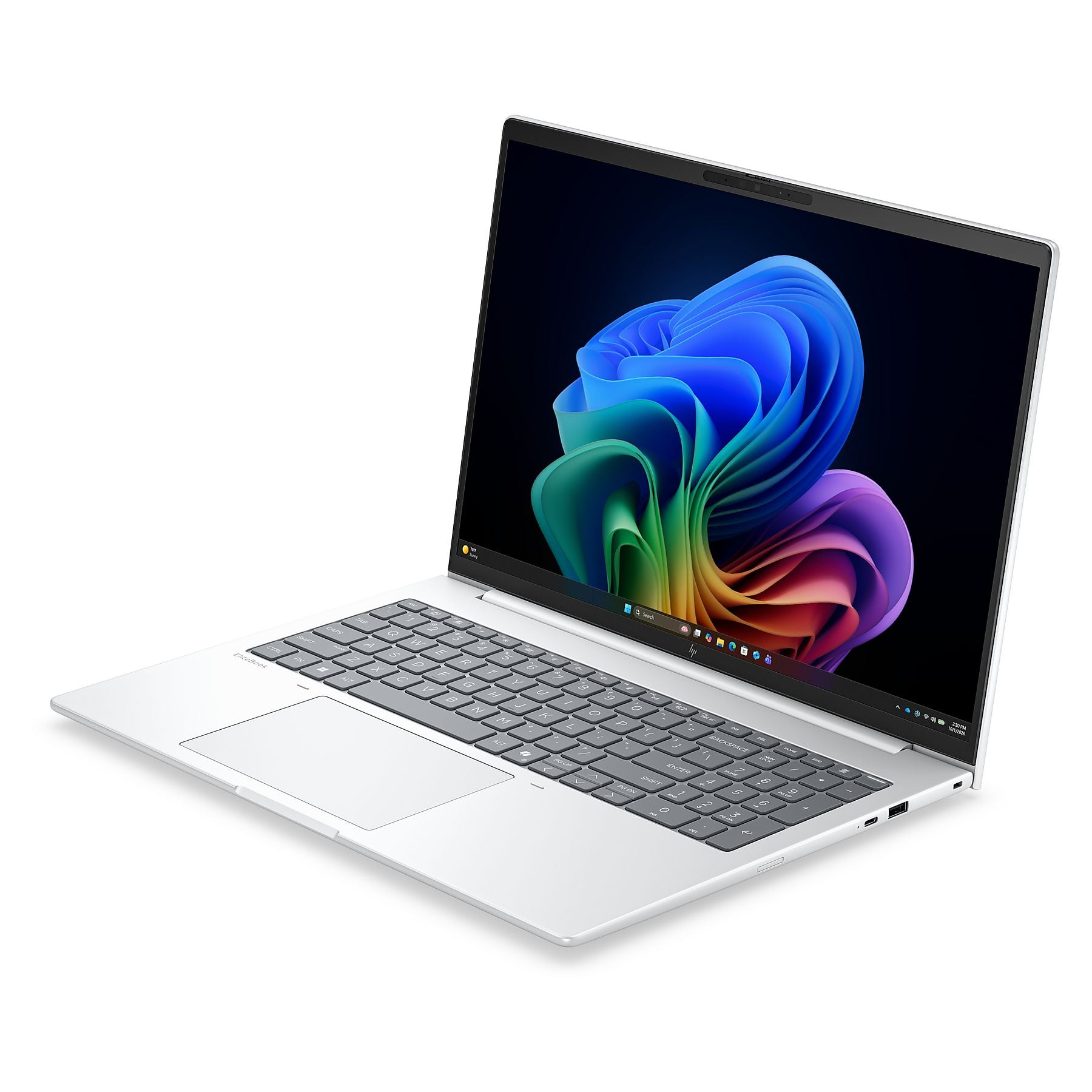 Un laptop argentato ed elegante, aperto, mostra tastiera e touchpad.