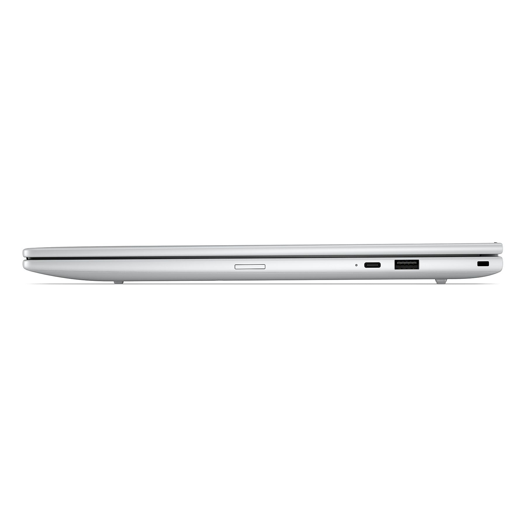 Vista laterale del laptop argentato. Porte USB-C e USB-A visibili.