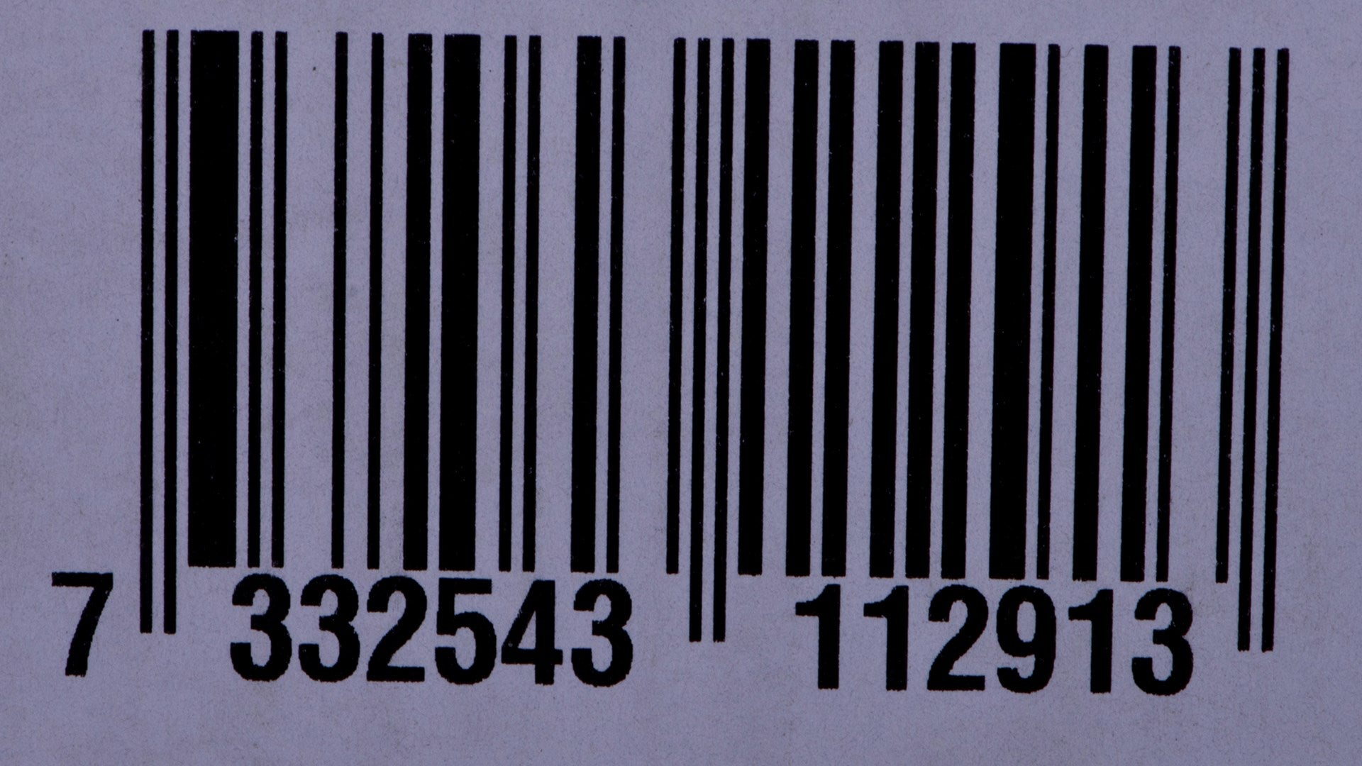 Un código de barras con los números 7 332543 112913.