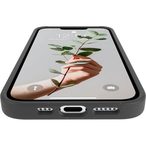 Un iPhone scuro con un ramo con foglie verdi sul suo schermo.