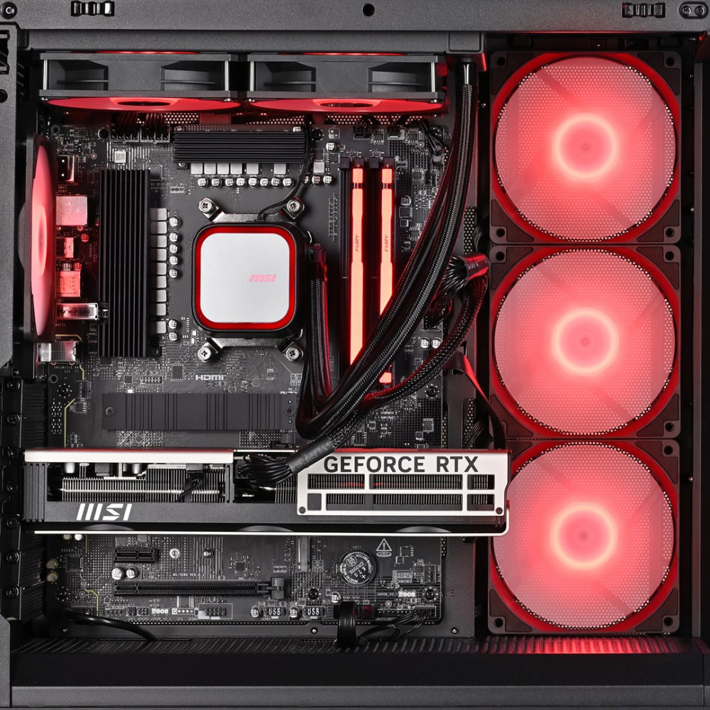 Interno del case del computer con scheda madre, GPU, dissipatore CPU, RAM e ventole LED rosse.