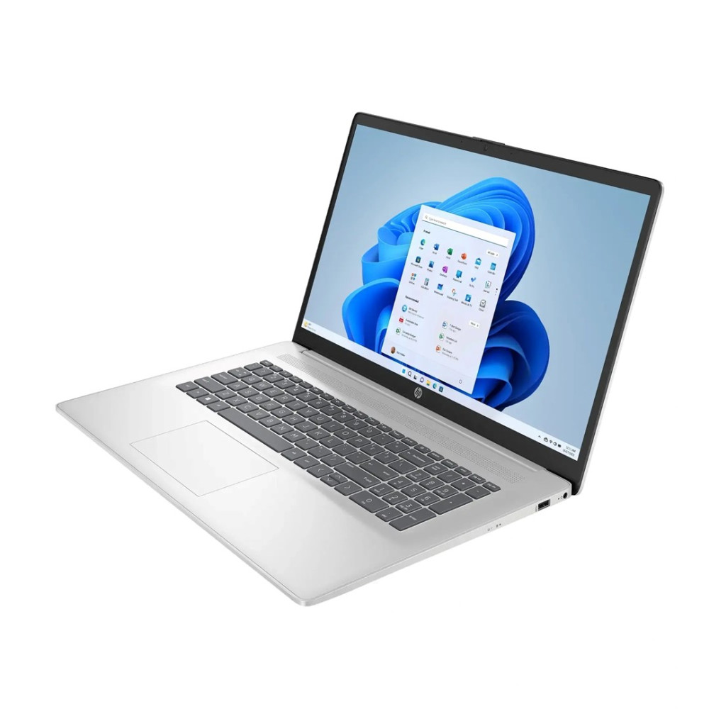 Srebrny laptop HP z systemem Windows 11 i niebieską tapetą.