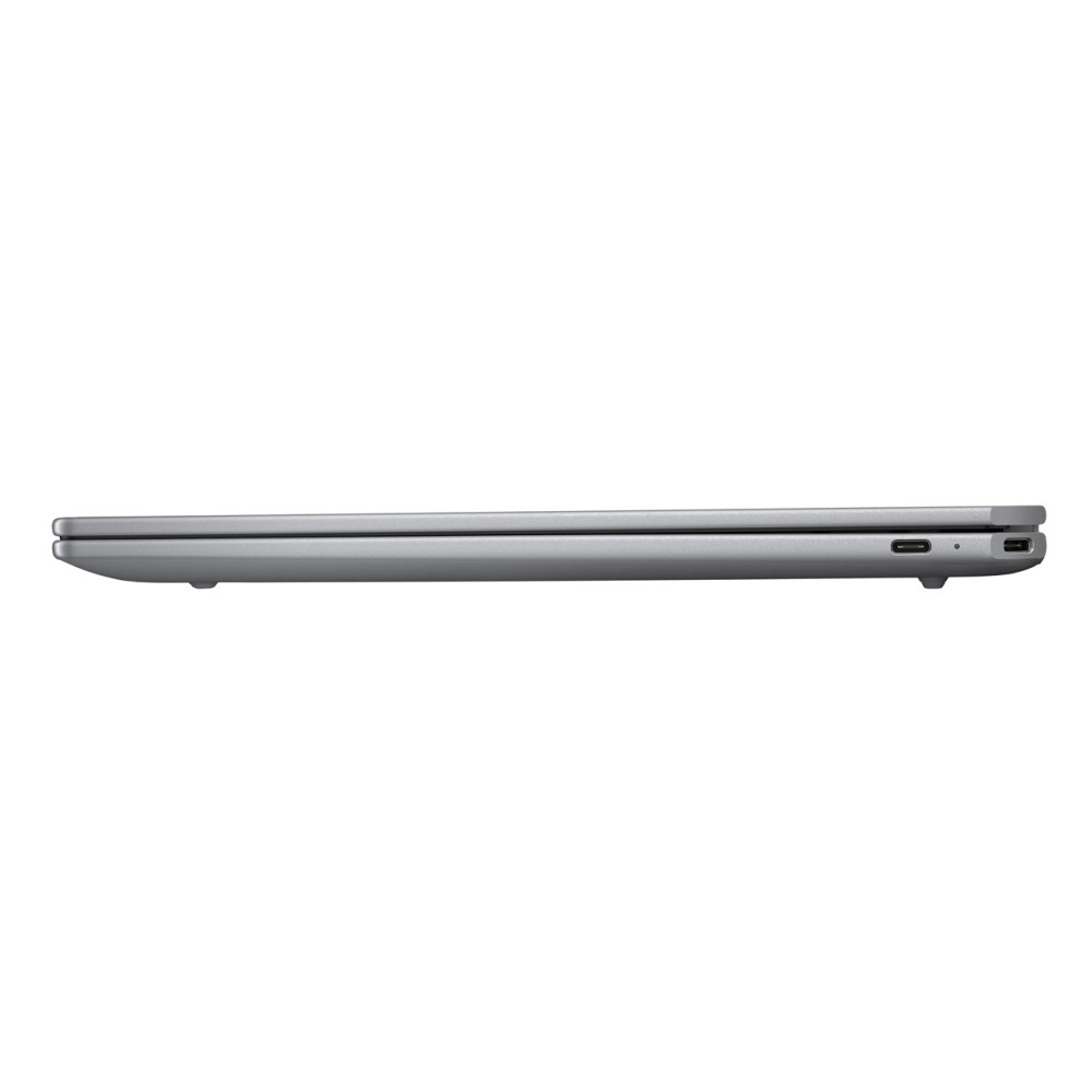 Zamknięty srebrny laptop w profilu, z dwoma portami USB-C po bokach.
