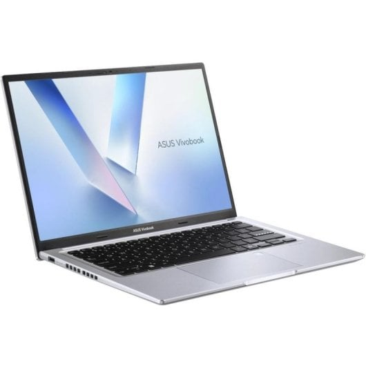 Srebrny laptop Asus Vivobook jest otwarty, pokazując klawiaturę i ekran.