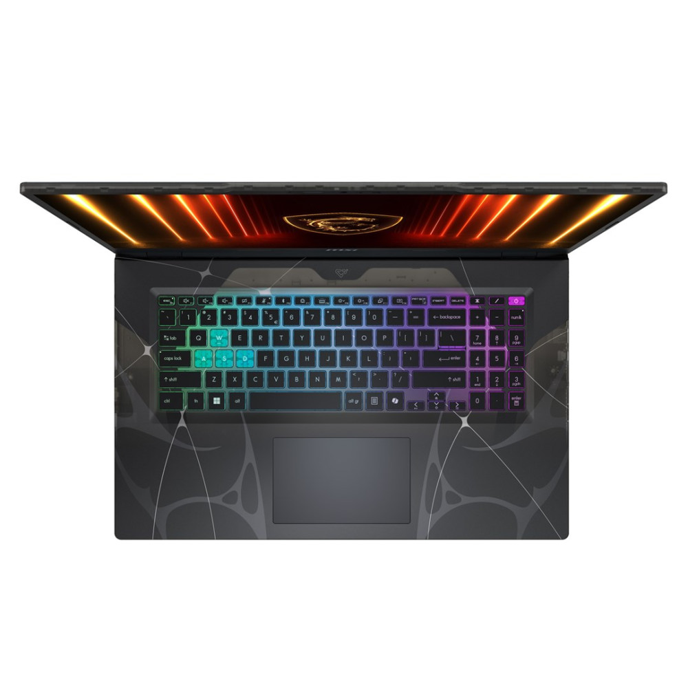 Otwarty laptop z podświetlaną klawiaturą i pomarańczowym tłem ekranu.