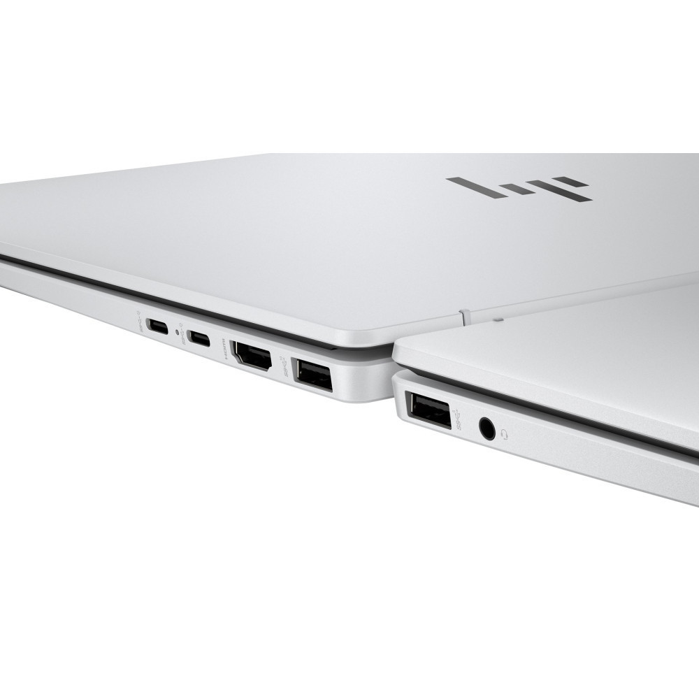 Zbliżenie dwóch białych laptopów obok siebie. Widoczne porty.