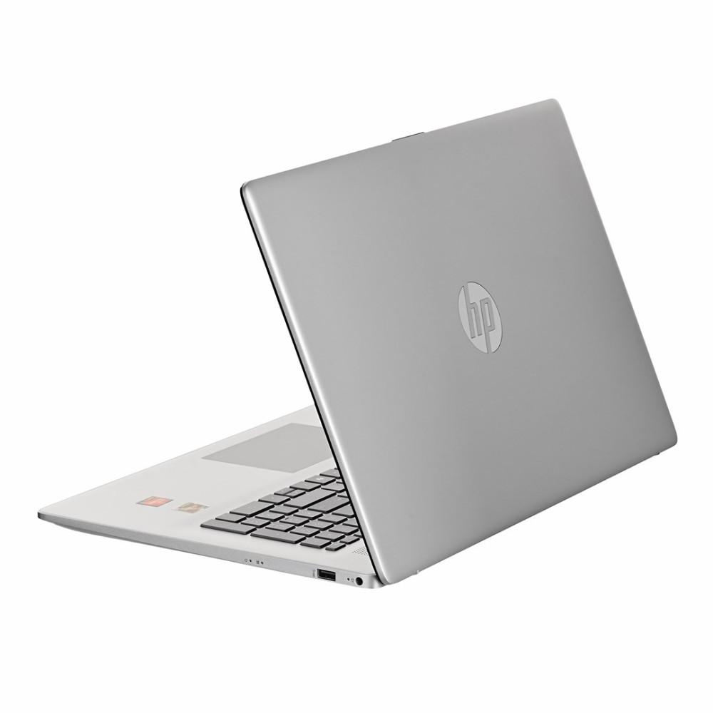 Srebrny laptop HP jest otwarty, widoczna klawiatura i touchpad.